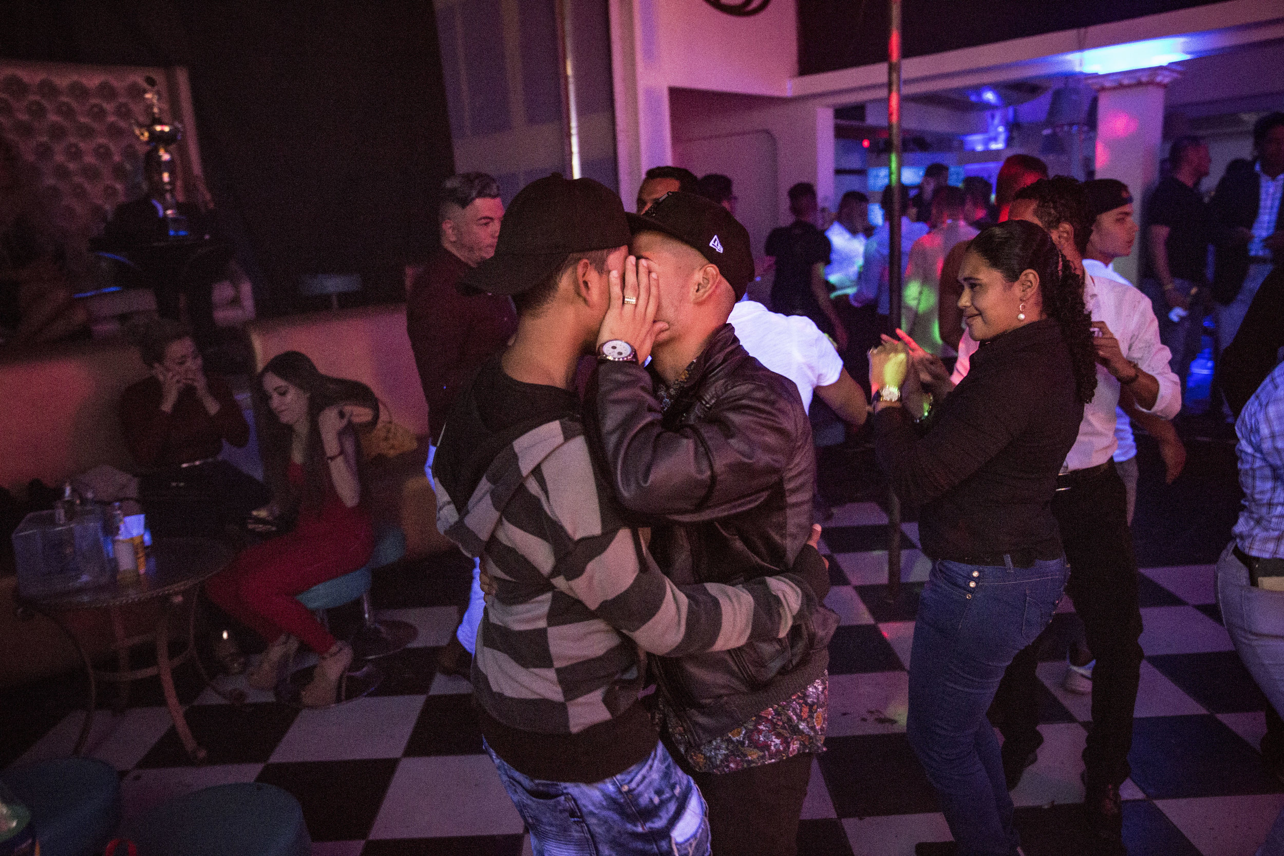 A couple kissing in a gay friendly club in Tegucigalpa.