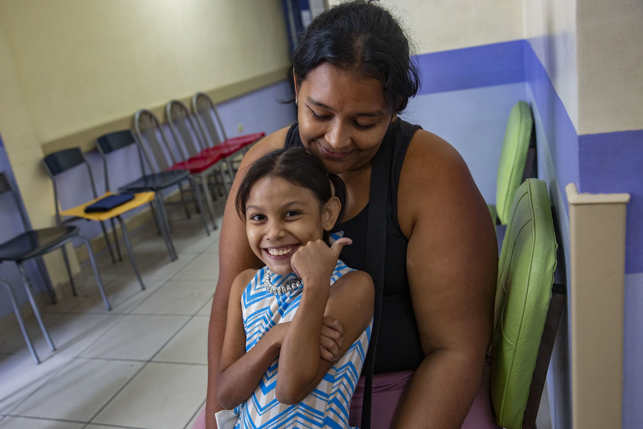 A mother and child waiting to be visited by Dr. Craniotti, head and pedriatic surgeon at the Ruth Paz hospital in San Pedro Sula, Honduras.
