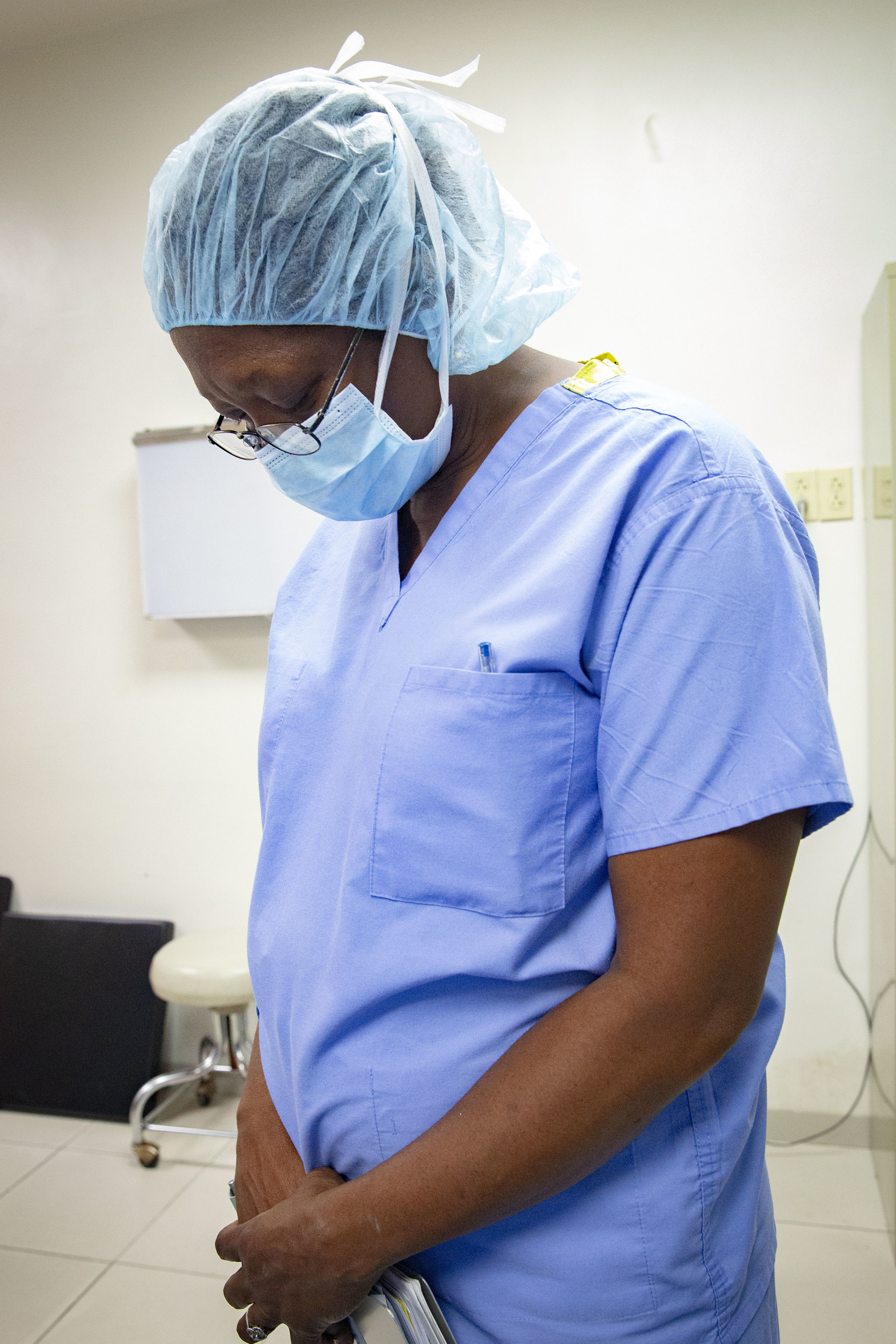  A nurse prays ahead of a surgery operation on a child at the Ruth Paz hospital in San Pedro Sula, Honduras. 