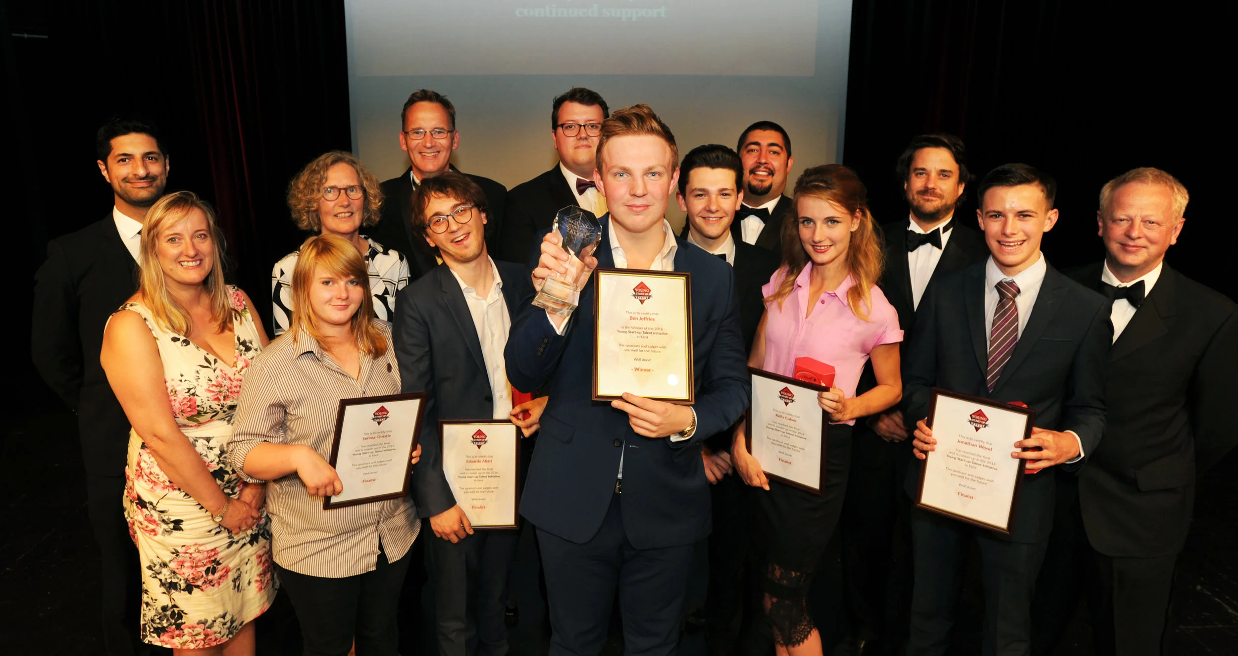 YST Kent judges, finalists and winner (left to right – Michael Adamou, Lorraine Nugent, Jackie Sumner, Serena Christie, Richard Reid, Edoardo Abati, Rob Nunn, Ben Jeffries, Ben Towers, Matt Turner, Kelly Culver, Pete Kenyon, Jonathan Wood and Simon Warne)