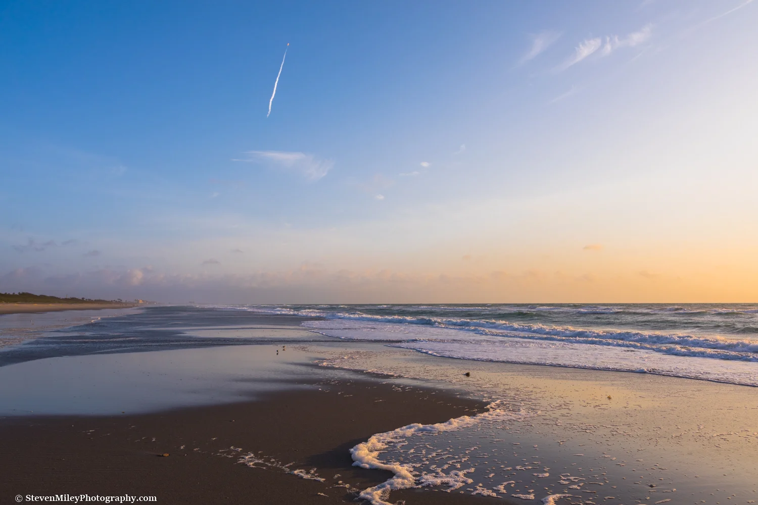 A SpaceX Falcon 9 rocket shoots into space above a lonely section of beach near Patrick Air Force Base. 