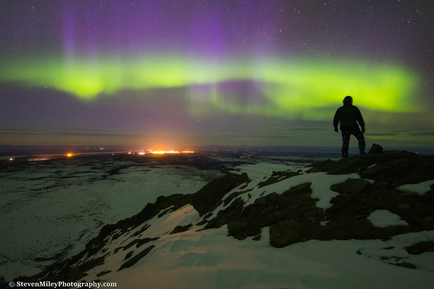 View of Fort Greely and the Missile Defense Complex from Donnelly Dome prior to lighting the torch. Light pollution is noticeably reflecting off the snow over 10 miles away in this long exposure.