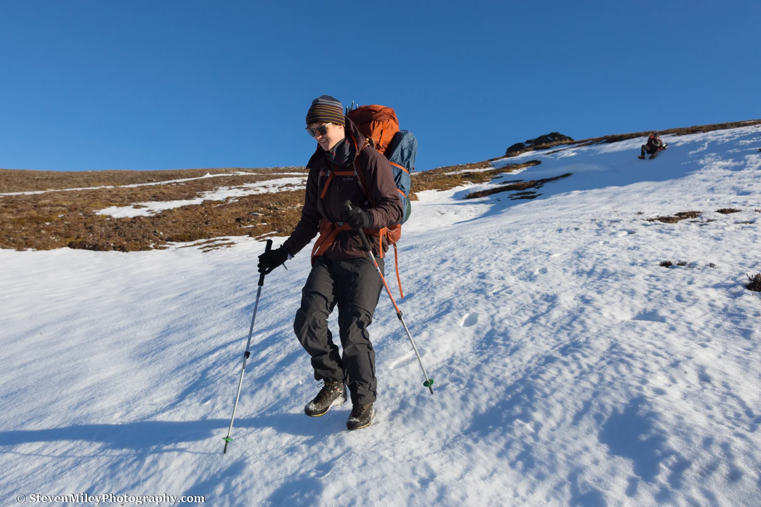 Hiking and glissading back to the highway. Devils Thumb is peeking over the ridge between Grant (left) and Matt (right).