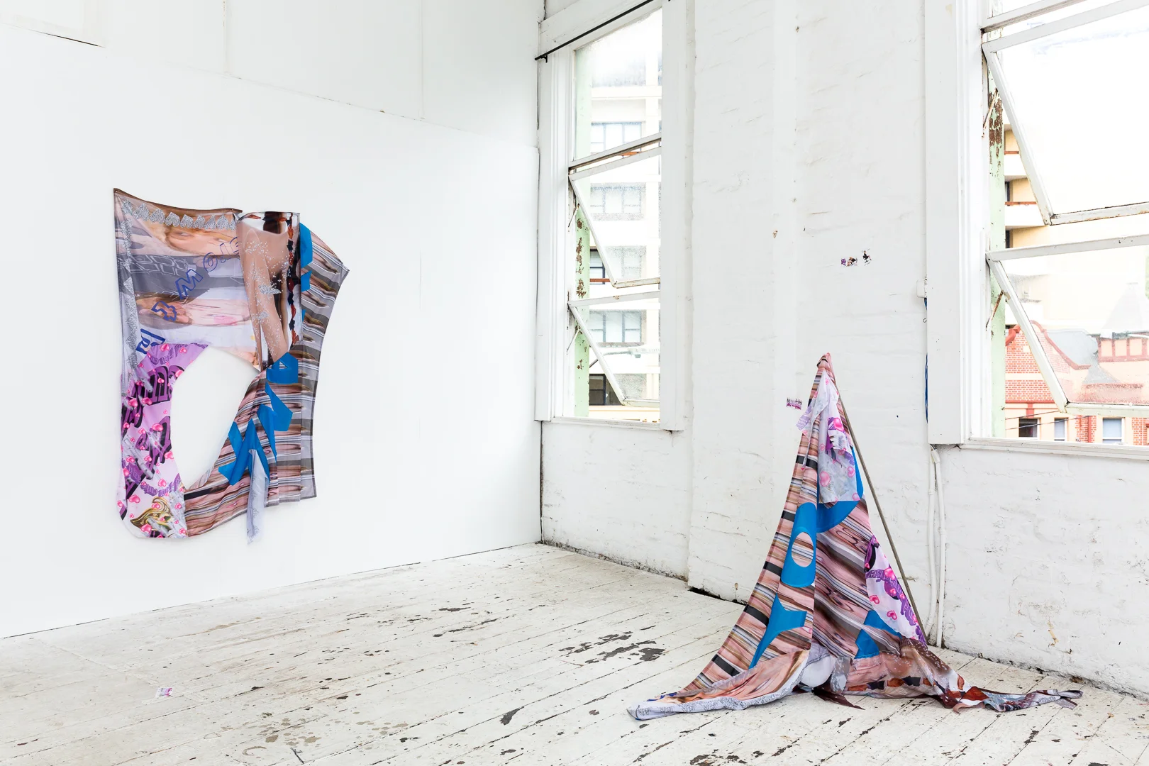 Dreams of an Assistant II (background), (2018), digital print on polyester ; Dreams of an Assistant III (foreground), (2018), digital print on polyester, stainless steel rods, installation view, Number One Assistant, Kyra’s, Sydney. Photo: Document Photography