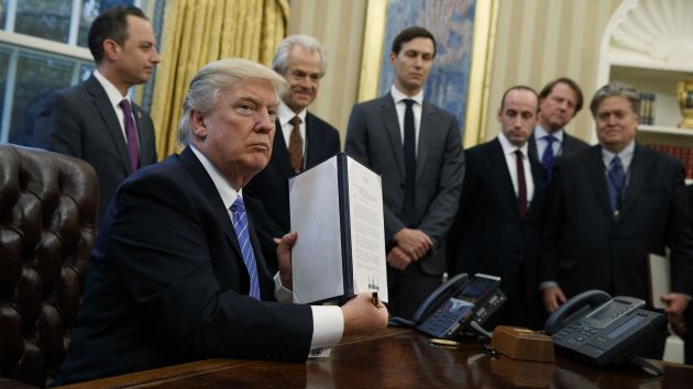 President Donald Trump reinstating the Mexico City Policy. Image source: Mother Jones, 2017.