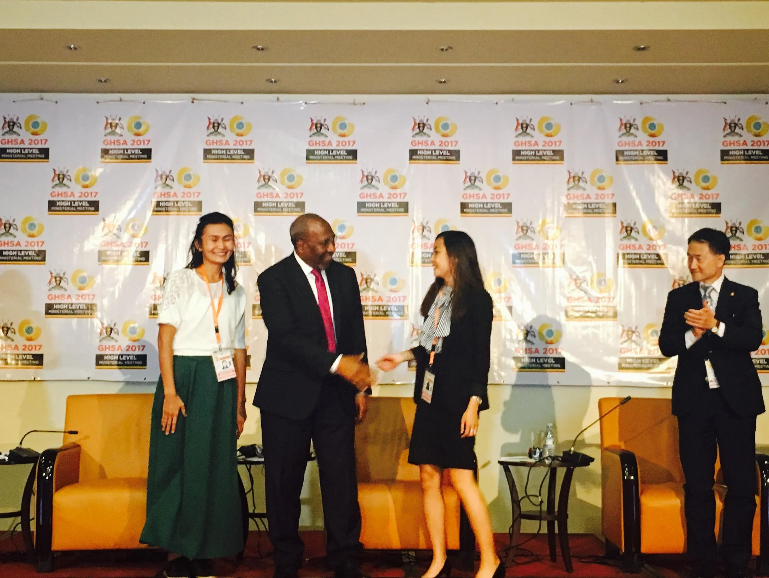 From left to right: Lyazzat Musralina (Scientific Researcher at Institute of General Genetics and Cytology of Kazakhstan), Hon. Ruhakana Rugunda (Prime Minister, Uganda), Ashley Tseng (McGill University), and Hon. Park Neunghoo (Minister of Health & Welfare, Republic of Korea). Ashley is shown here shaking the Prime Minister of Uganda’s hand after his announcement of her and Lyazzat as the winners of Nuclear Threat Initiative’s Next Generation for Biosecurity in GHSA Competition.