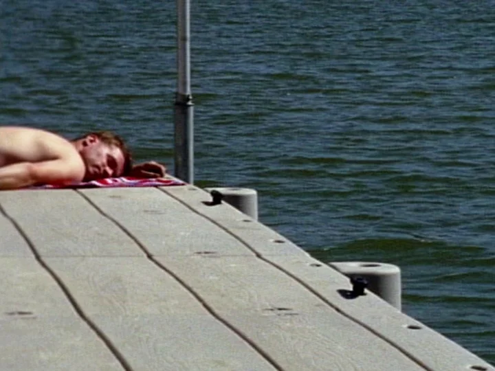 Castaic Lake Brigid McCaffrey 2010 | 29 minutes | USA | 16mm | color | sound Taking its course, the camera drifts in to the coves and surveys the shorelines of a multi-use reservoir to unearth fragments of its young history and consider a series of possible relationships to this artificial environment. Visits are filled with a sense of potentials and the unseen, the lake’s surface separating what is buried and what is to come. Municipal orchestrations, recreational episodes, and small pageants trace this body’s perimeter. -BM