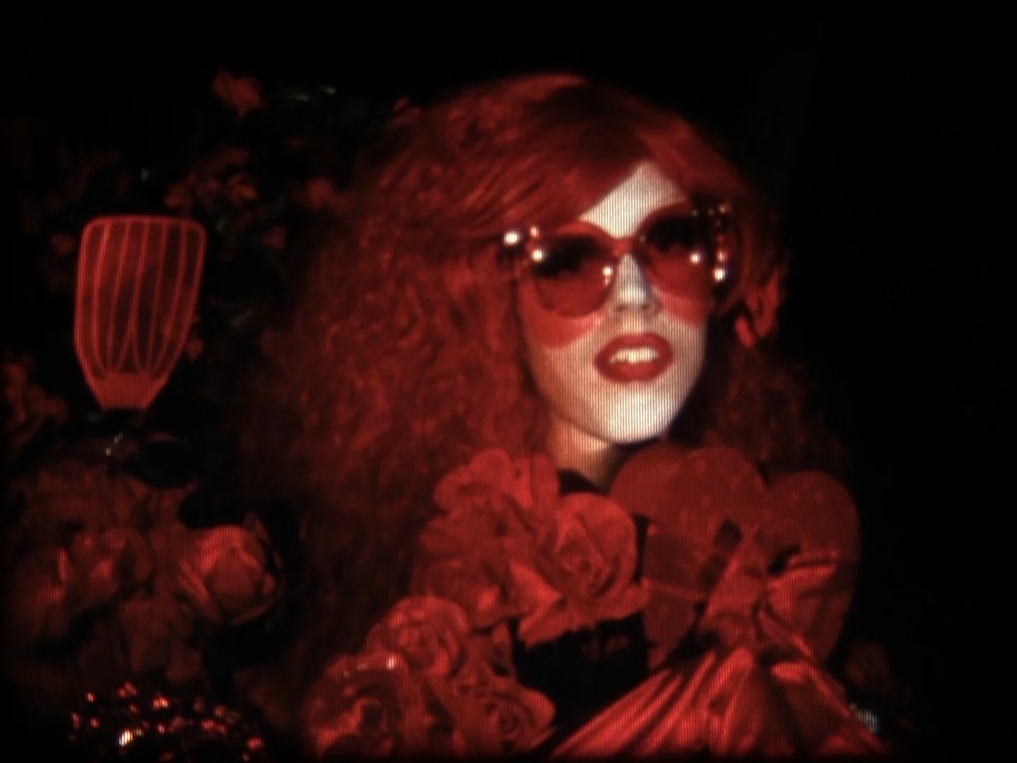 Song for Rent, after Jack Smith Malic Amalya 2018 | 6 minutes | USA | 16mm | color | sound With Kate Smith singing God Bless America looped in the background, experimental filmmaker Jack Smith starred as Rose Courtyard—a drag character based on Rose Kennedy—in his 1969 film, Song for Rent . In this adaptation, Barbarella Bush joins Rose in a campy exploration of US nationalism, queer assimilation, and denunciation. -MA