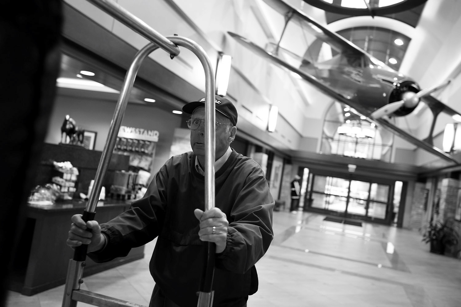 On a rainy day Martin, loads luggage in the general aviation lobby at Bluegrass Airport. "I think the love of flying is a bug that bites you. After I took my first instructional flight it was just there." 