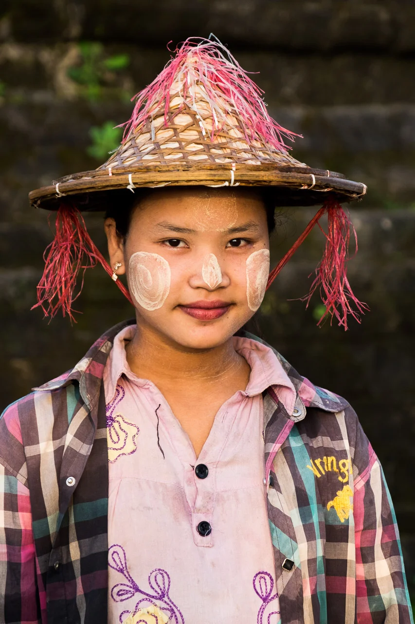  A Burmese girl wearing Thanakha; a paste made of ground bark, used by many Burmese females for both sun protection and makeup.  Burma 2015 - Francesco Vicenzi Photography 