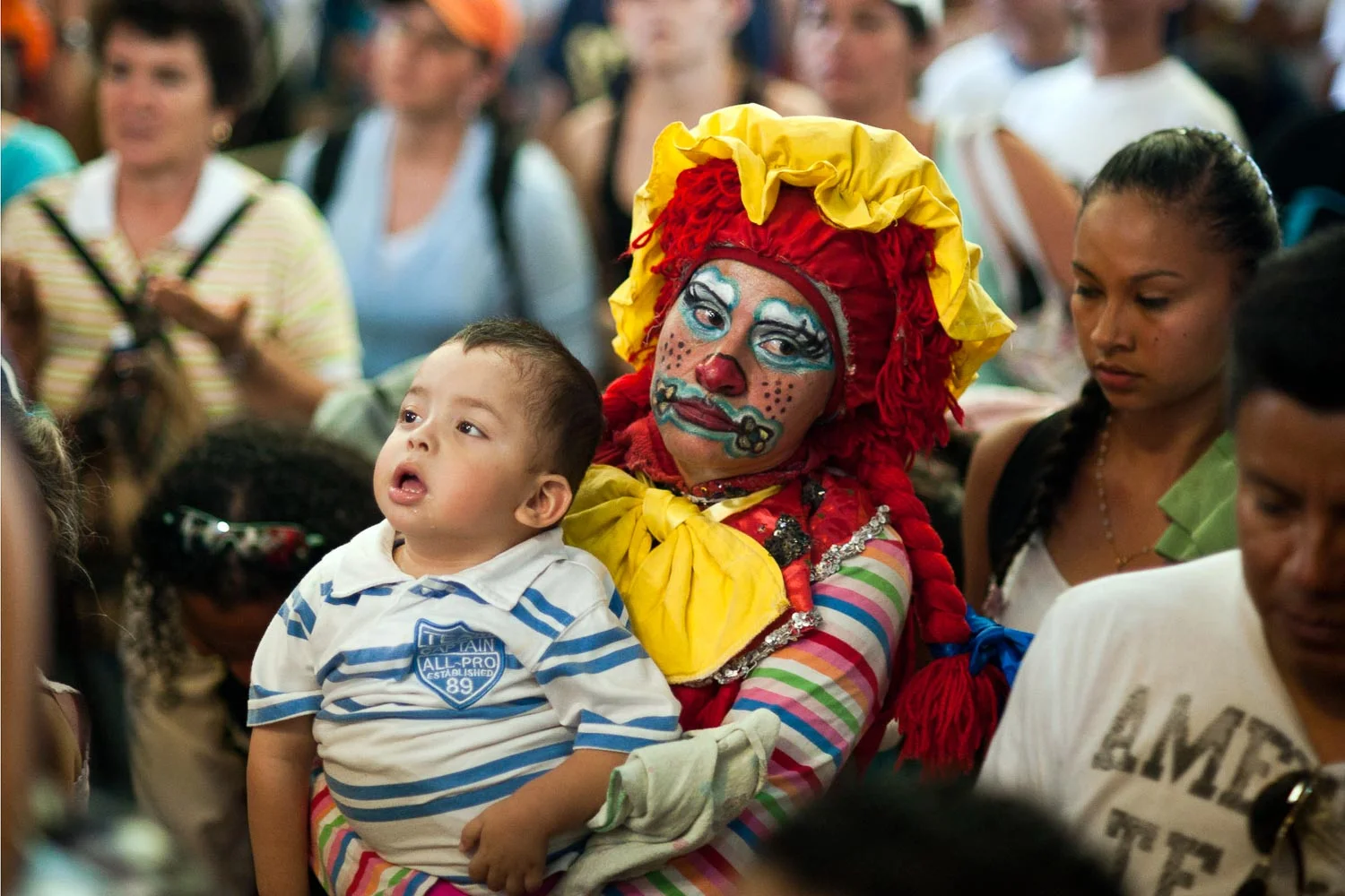  Floriberth Abarca Monje is a professional clown, she is affected by many disease and she has to bring in her wallet medical instuctions about what to do if she loose consciousness. She already had heart surgery three times. She carried with her the little Kevin Ortega Picado (2 YO, not her son) that suffers of growing diseases that block him from walking alone and talking. He also has a liver and testicular illness more than a bad anemia.Floriberth promised to bring Kevi from Desamparados, where he lives, to the Virgin. She’s asking “ just life, for both ”. Through and organization they’re asking to Chinchilla’s government a wheelchair for Kevin. She never heard about Patch Adams, this makes of her an amazing Patch Floriberth.Cartago Romeria Pilgrimage 2010 - Almost 2 milions of faithful pilgrims walked the 30 km between San José and Cartago to pay homage to the Virgen of Los Angeles - Francesco Vicenzi /Tico Times 