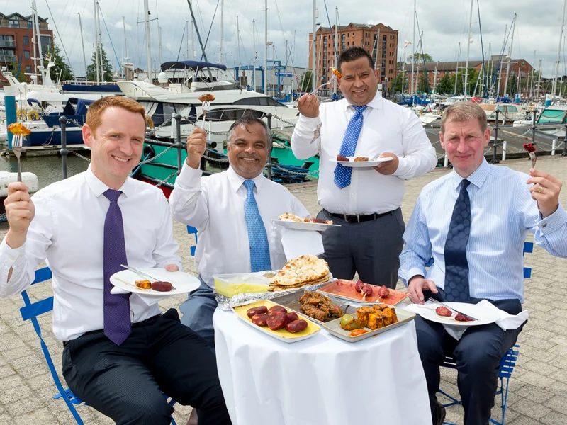 From left, Tom Watson, Tapan Mahapatra, Mukesh Tirkoti and David Donkin raise their forks to the forthcoming opening of Tapasya @ Marina overlooking Hull Marina.