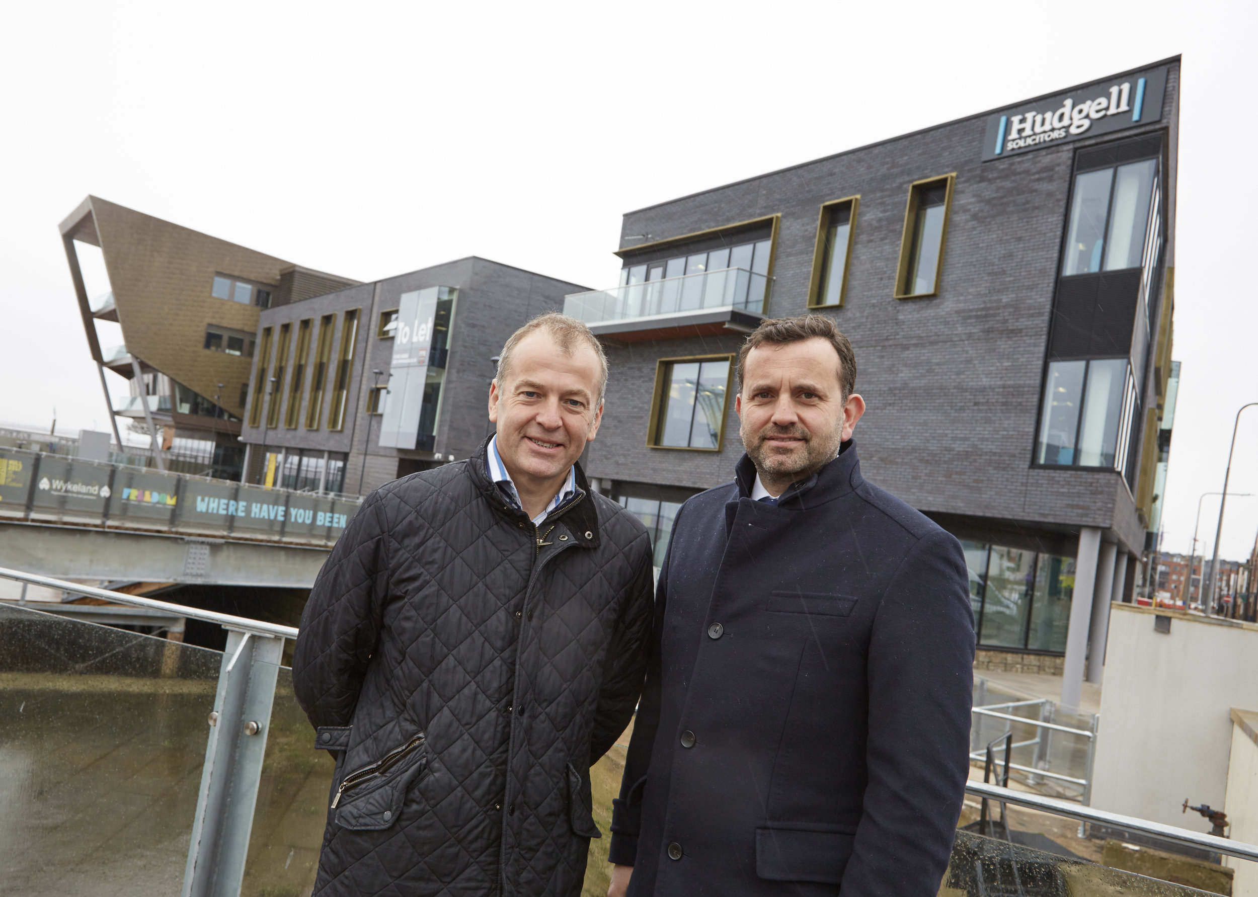 Hudgell Solicitors Managing Director Neil Hudgell, left, with Wykeland Group Managing Director Dominic Gibbons at the @TheDock development in Hull’s Fruit Market. The specialist law firm says its move to the site demonstrates its long-term commitment to Hull.
