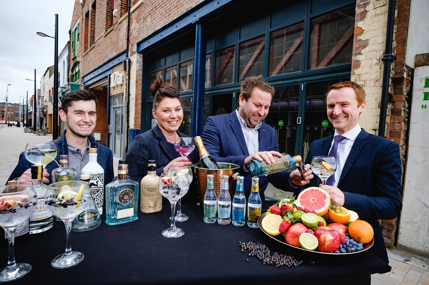 From left, Craig Heads, Charlotte Bailey and Lee Kirman from Humber Street Distillery Co with Wykeland Group’s Tom Watson and some of the 100 varieties of gin that will be on offer at the new gin bar and distillery.