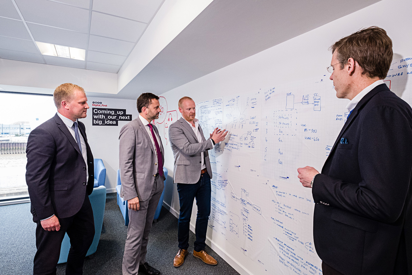 Arco’s Digital Director Richard Martin explains the company’s Digital First programme to Wykeland Group’s Dominic Gibbons and John Gouldthorp, left, watched by Arco Chief Executive Neil Jowsey