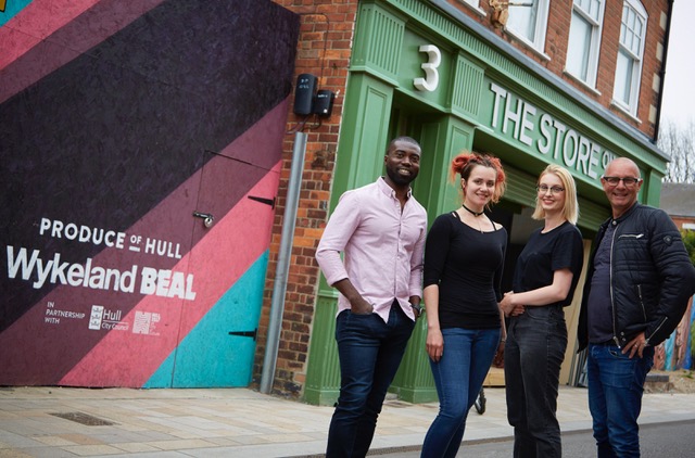 Owners Phil Benson, left, and Jonathan Elvidge with Manager Katherine Gregory, second left, and Sales Assistant Beth Hall outside The Store on Pier Street in Hull’s Fruit Market waterfront quarter.