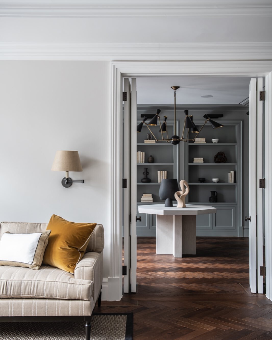 Much to love about the warmth this herringbone flooring offers against a cool calm joinery colour. Sourcing an eclectic collection of vessels and vellum books, we had as much fun dressing these shelves as we did designing the layout and flow of these