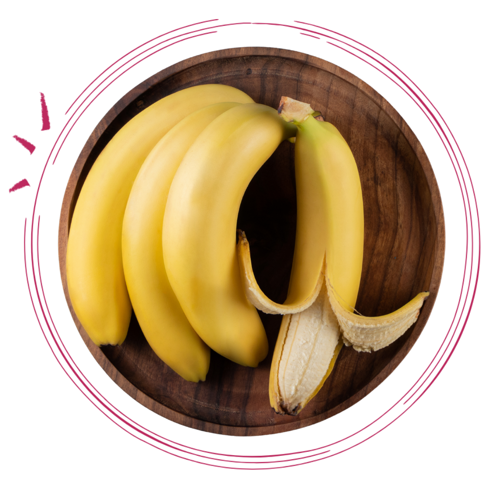 A wooden bowl containing several ripe bananas, with one banana partially peeled.