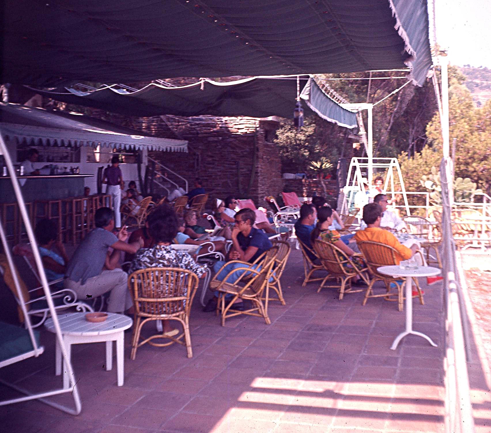 That swing seat by the bar
