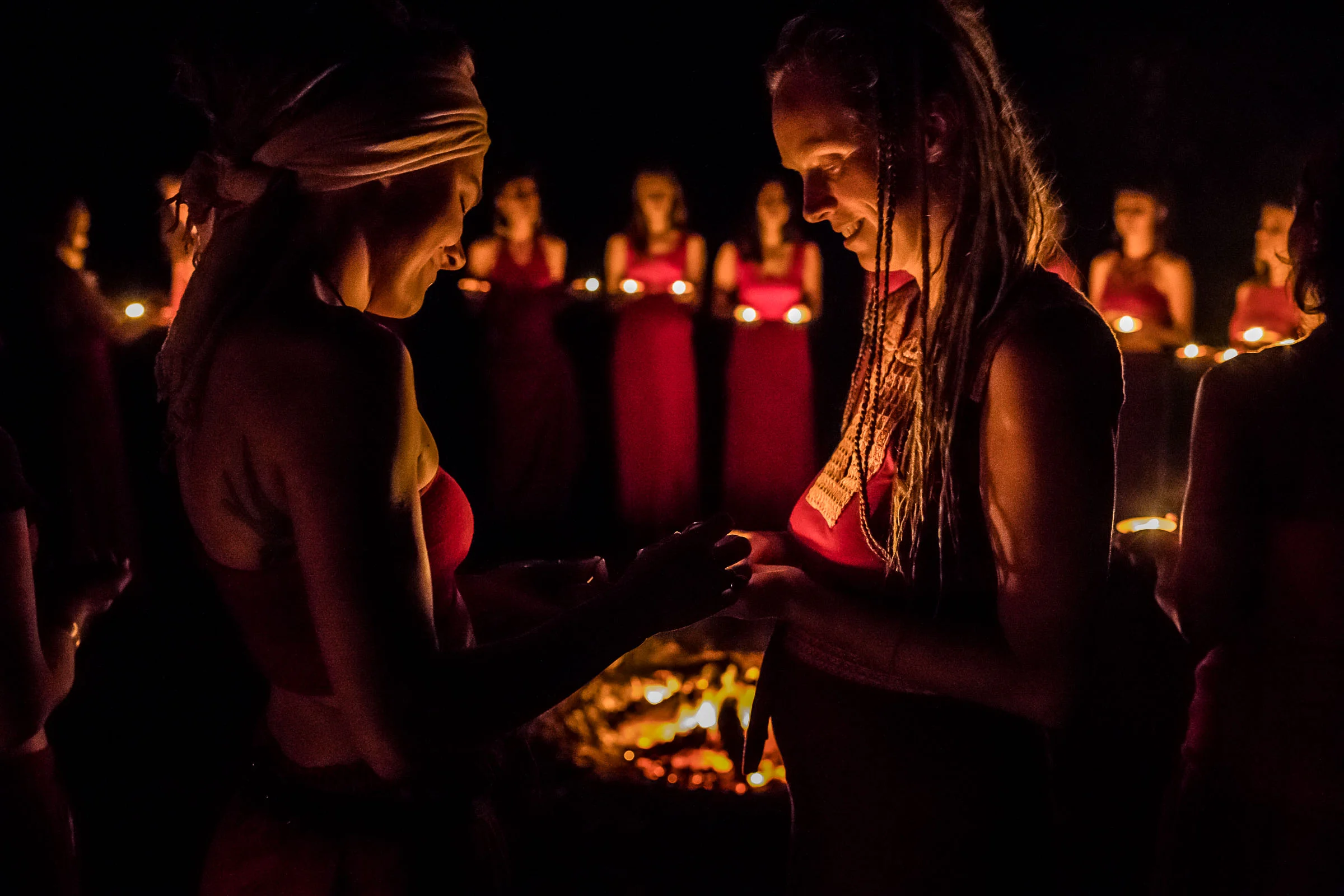 Women circle over the fire, Retreat ceremony capture by Portrait Photographer