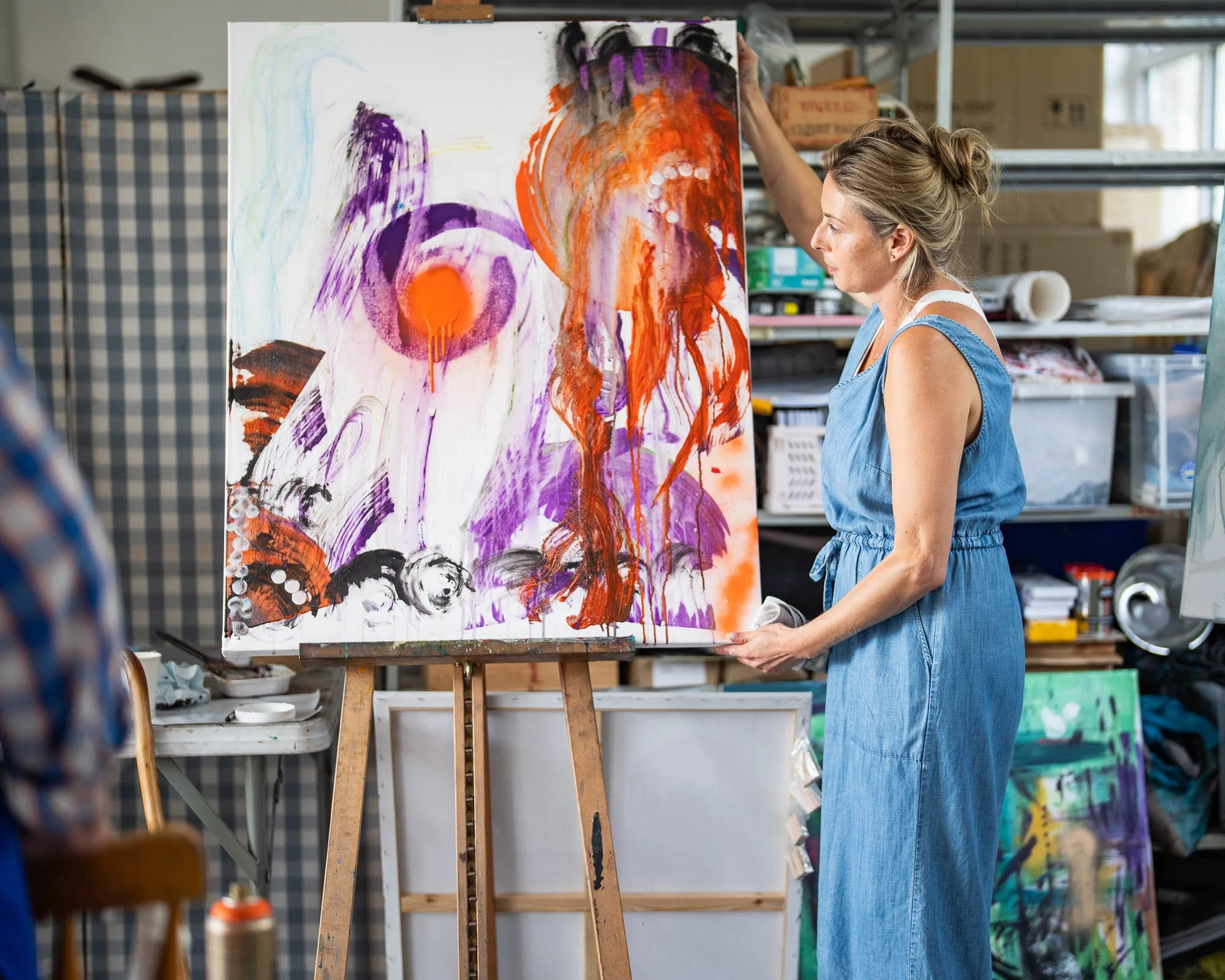 Paint textured mixed media abstract on large canvas with Magdalena in Brighton art studio Sussex UK