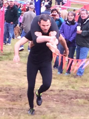 Dale carrying Sarah during the North American Wife Carrying Championship
