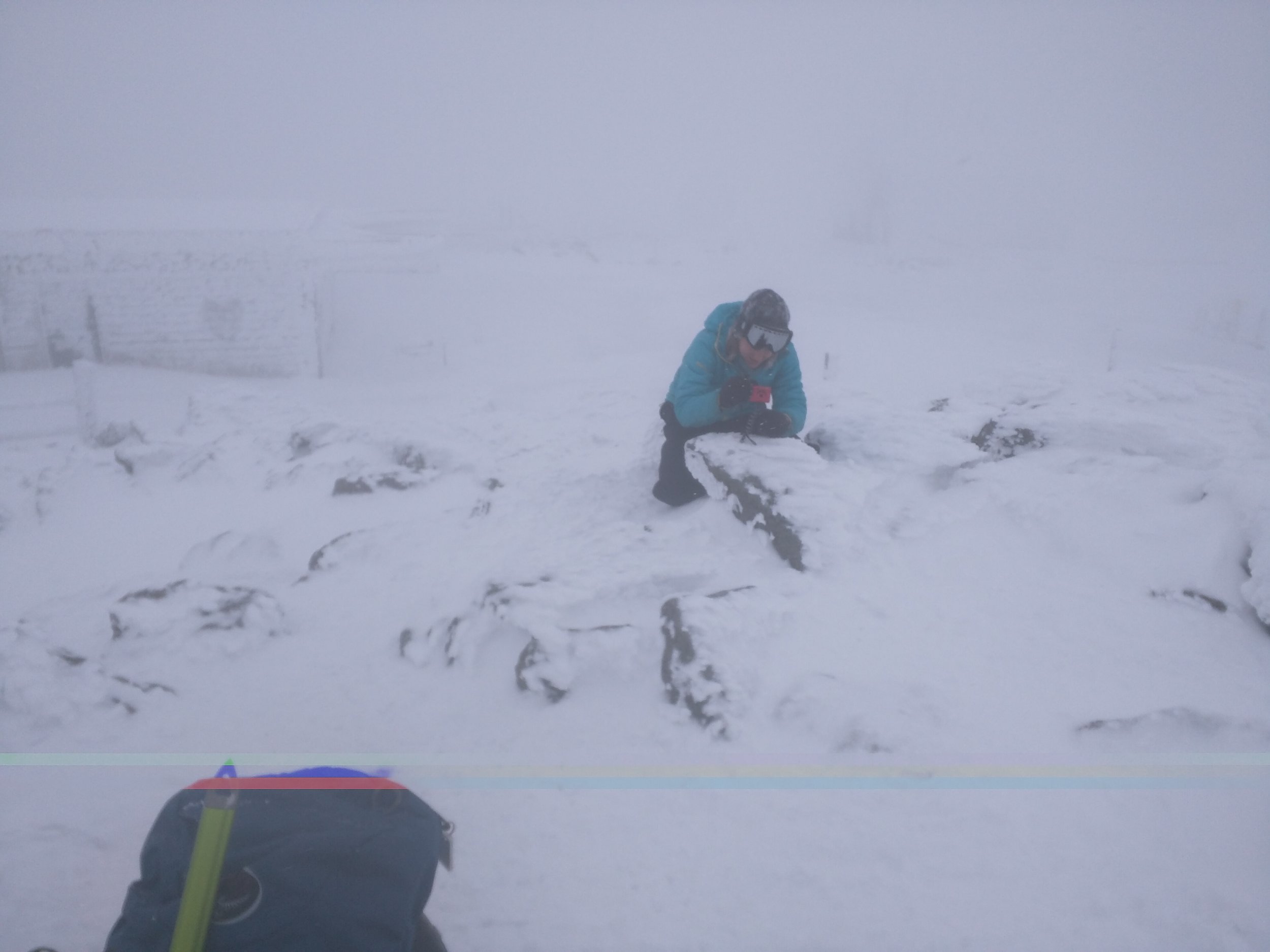 Dale is taking a picture of me taking a picture on the summit. The camera batteries were nearly dead because of the cold.