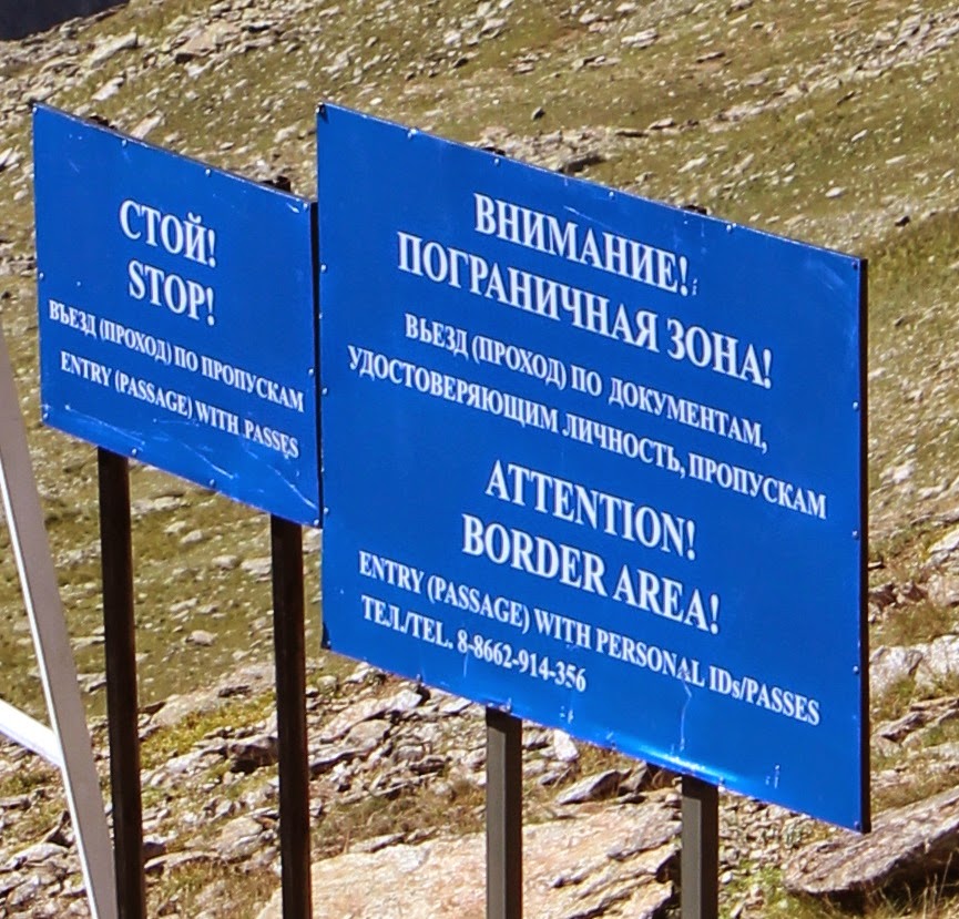 Sign on the border of Georgia and Russia on Mount Cheget.