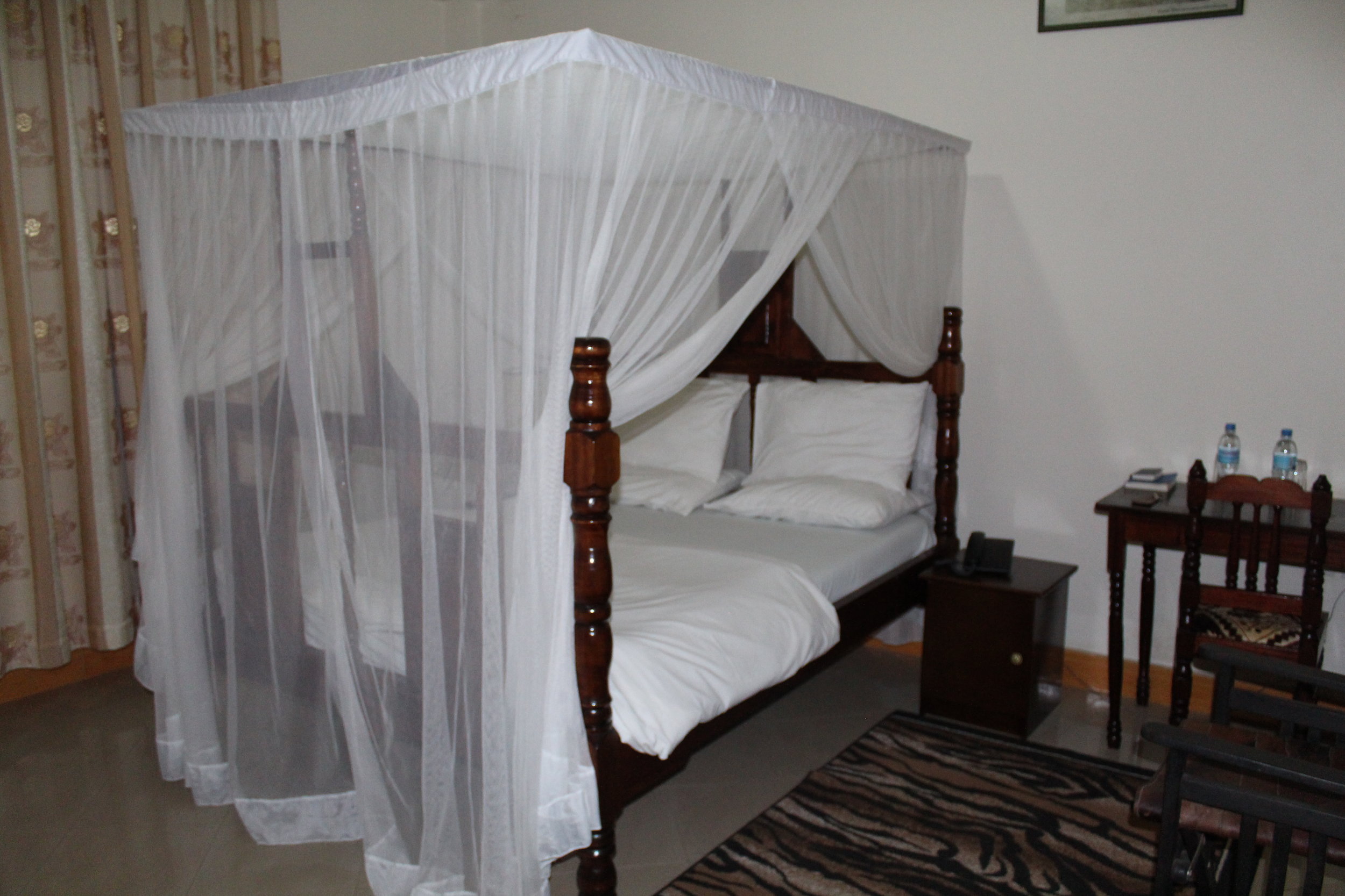 Our bed at Tumaini Cottage in Arusha.