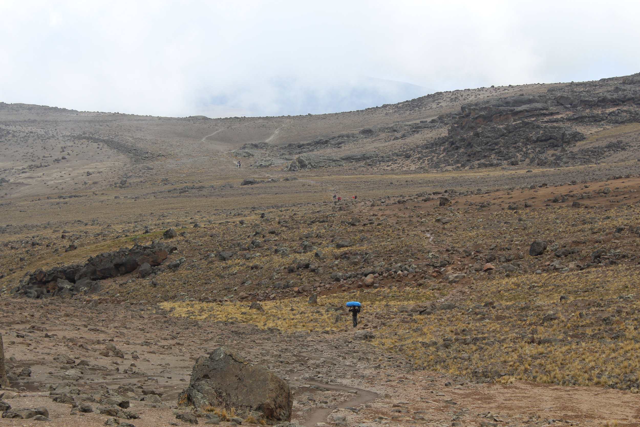 Porters making their way past Lava Tower