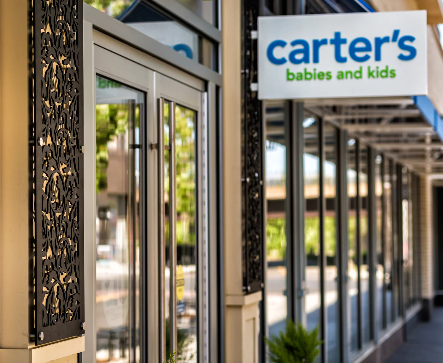 Carters, Commonwealth Building, Assembly Row Storefronts, Quincy, MA Crocus Spirals, Laser cut phenolic outdoor decorative panels