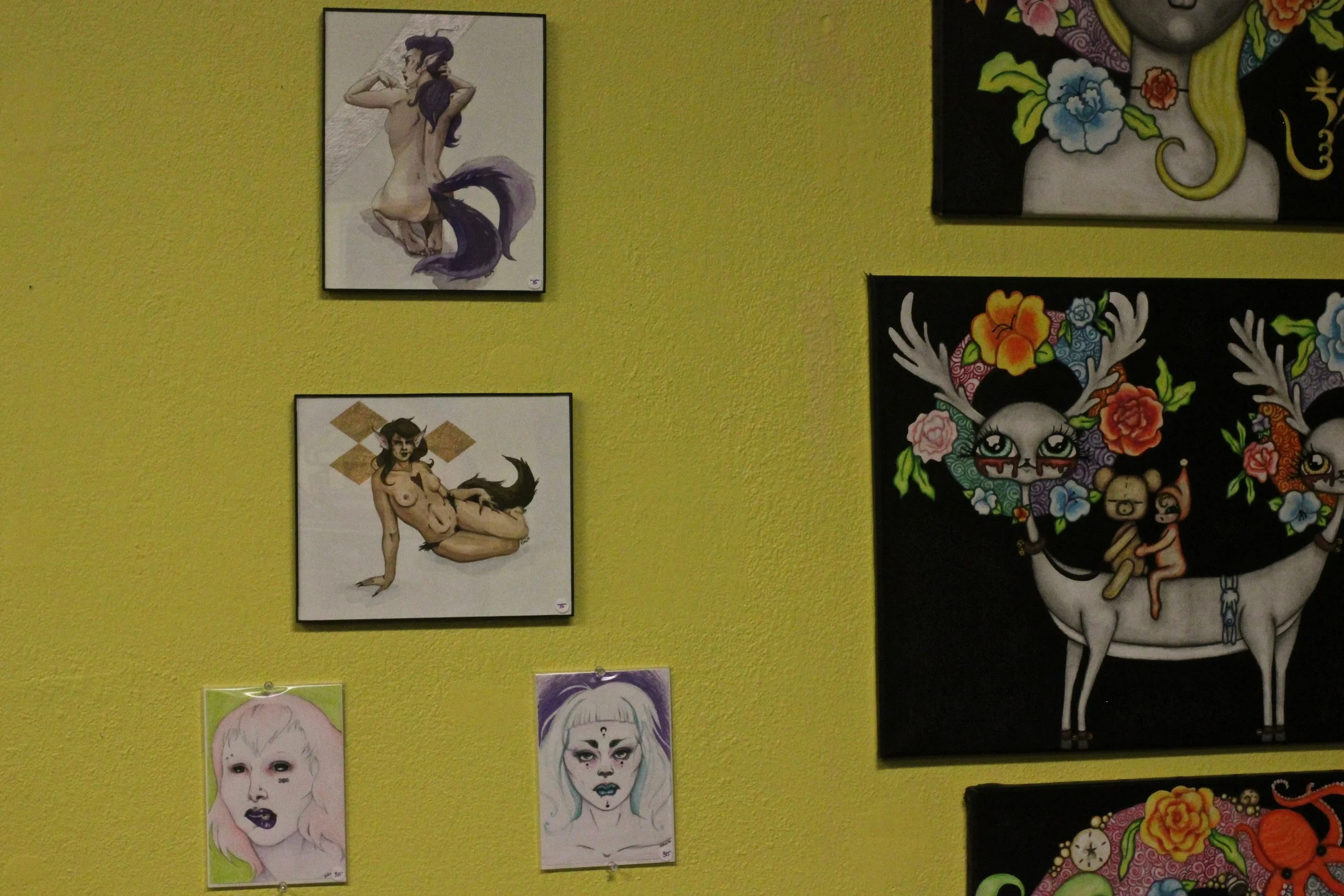 The artwork to the right of mine is by Elizabeth Carmella.