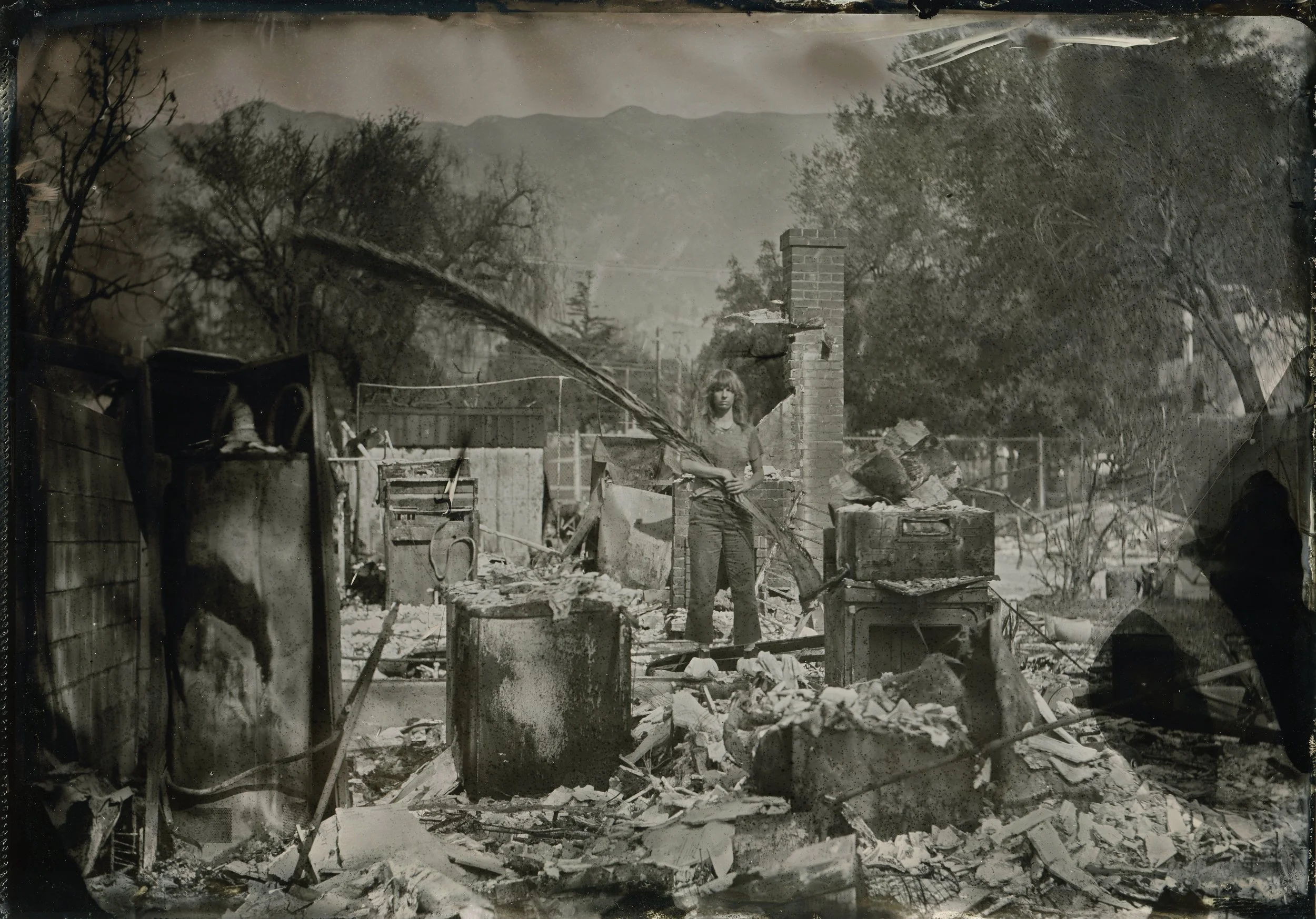  I lost my home and art studio in the Eaton Fire. Shortly after, with a donated large format camera, I returned to the ashes and made a self-portrait. That image helped me begin to process what had happened—and it gave me a way to reconnect with my p