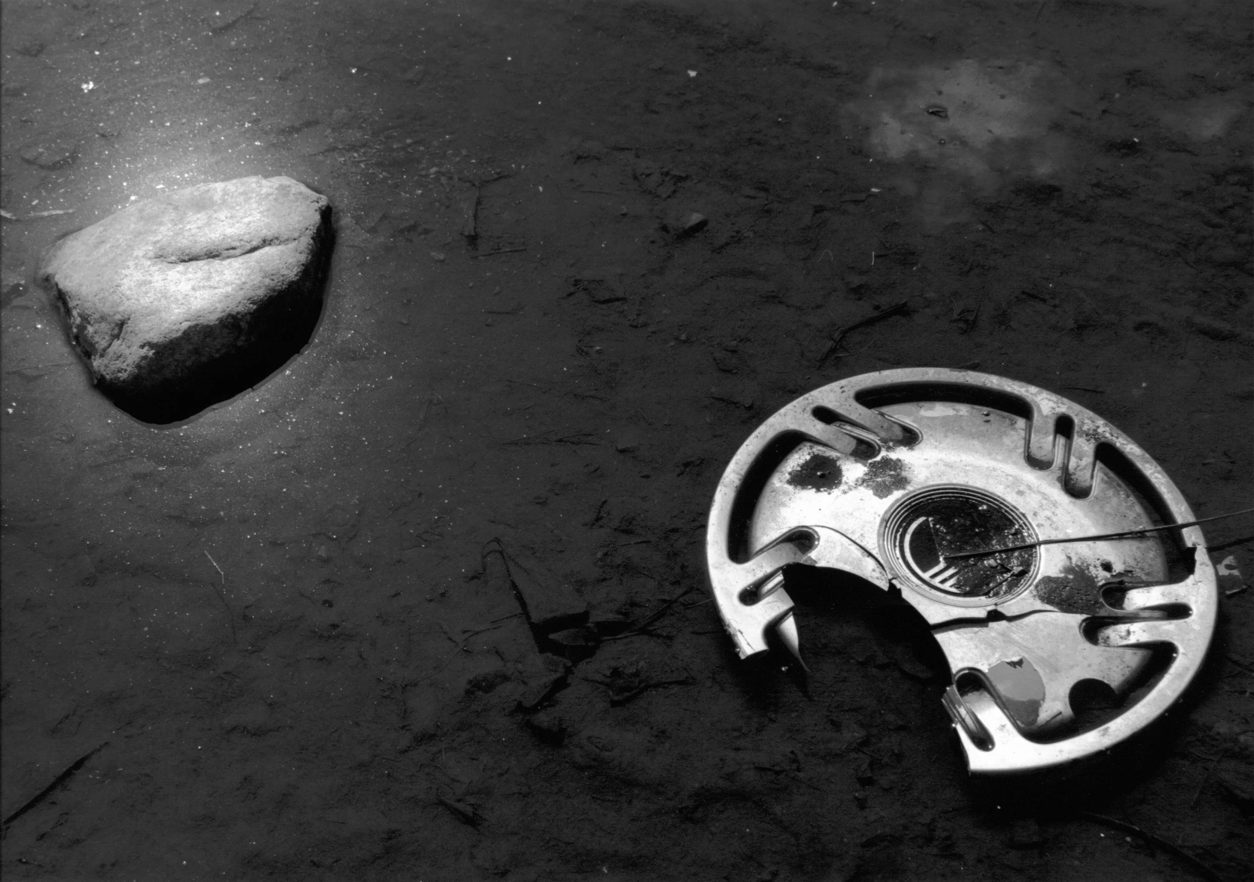 hubcap and rock