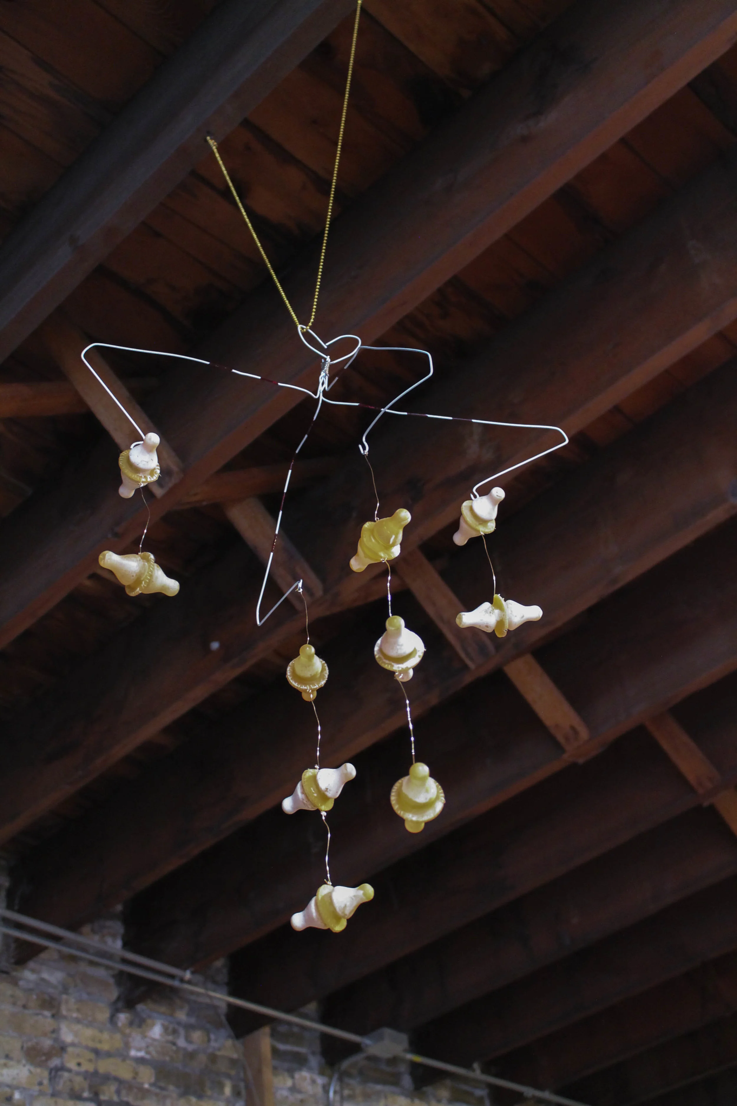 Unbridled (mobile) , 2016-2017 wire hangers, enamel, wire, thread, silicone bottle nipples