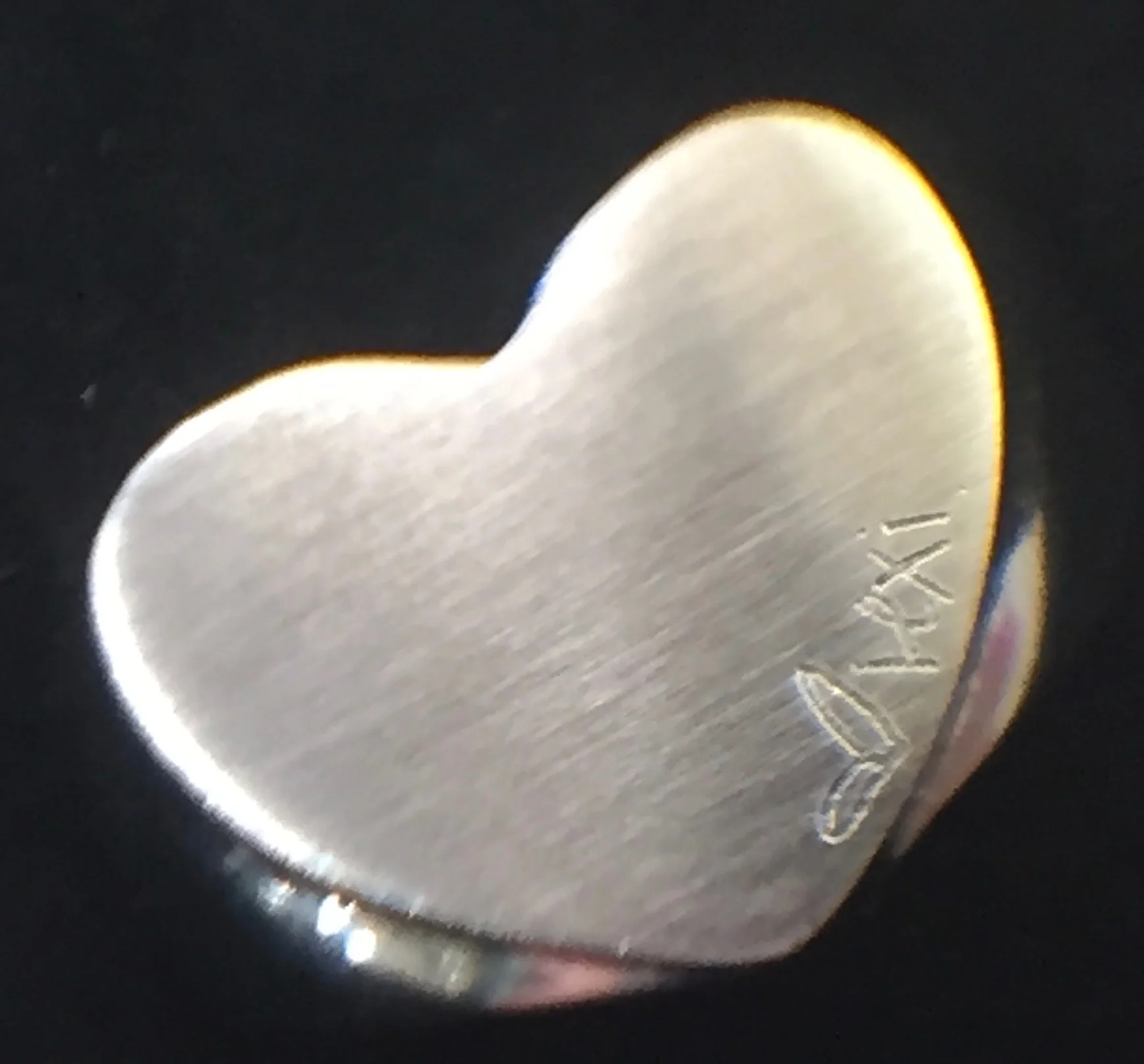 Lexi's signature on memorial heart ring.jpg
