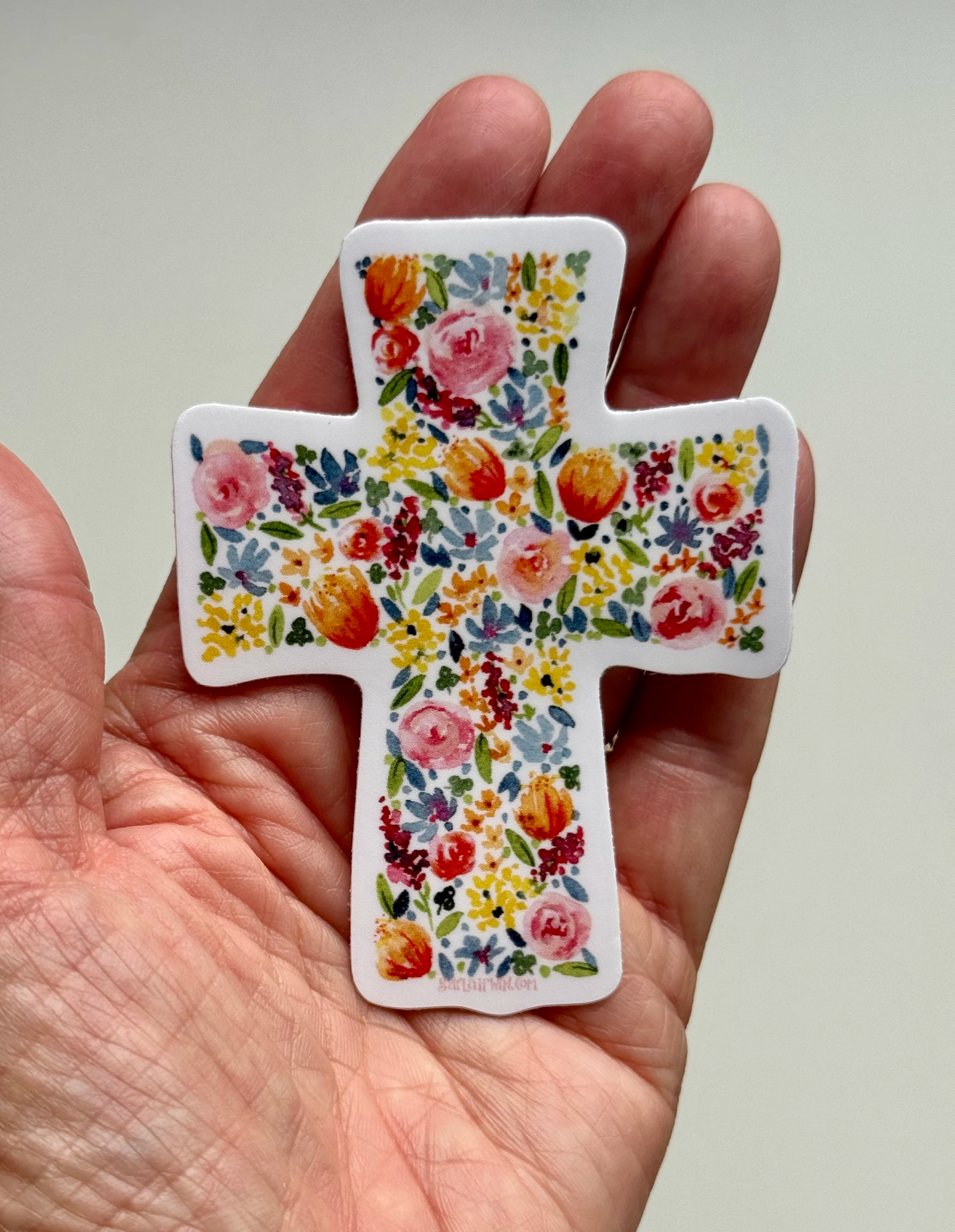 Floral_Cross_Sticker_with_hand.png