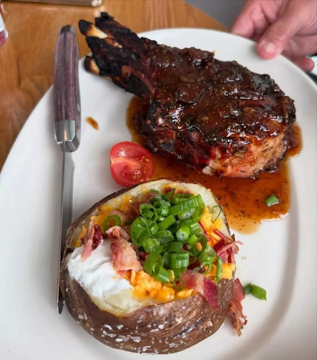 Ready to meet your weekend craving? Meet the Double Cut Pork Chop: a dish that is designed to impress, not just satisfy&nbsp;✨ 

🍽️ Cider fig glaze, loaded baked Idaho potato 

📸: @2die4foodie

#coastalkitchen #danapointeats #porkchop
