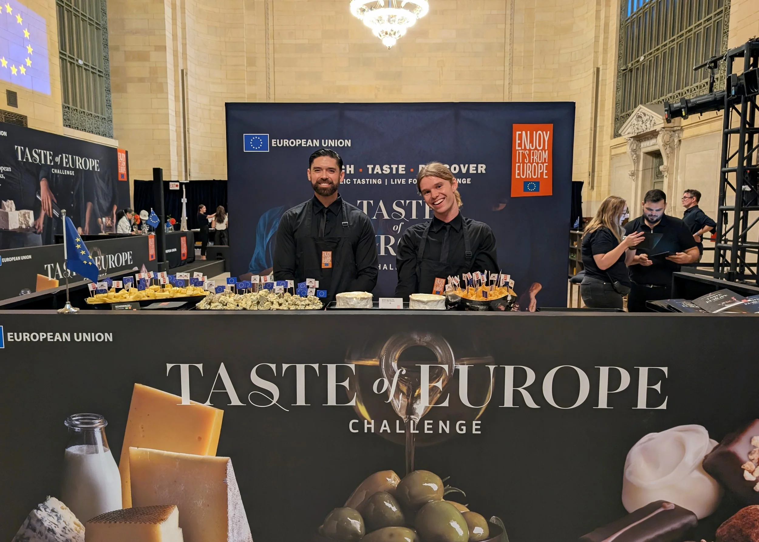 a large table full of cheeses at the Taste of Europe Challenge