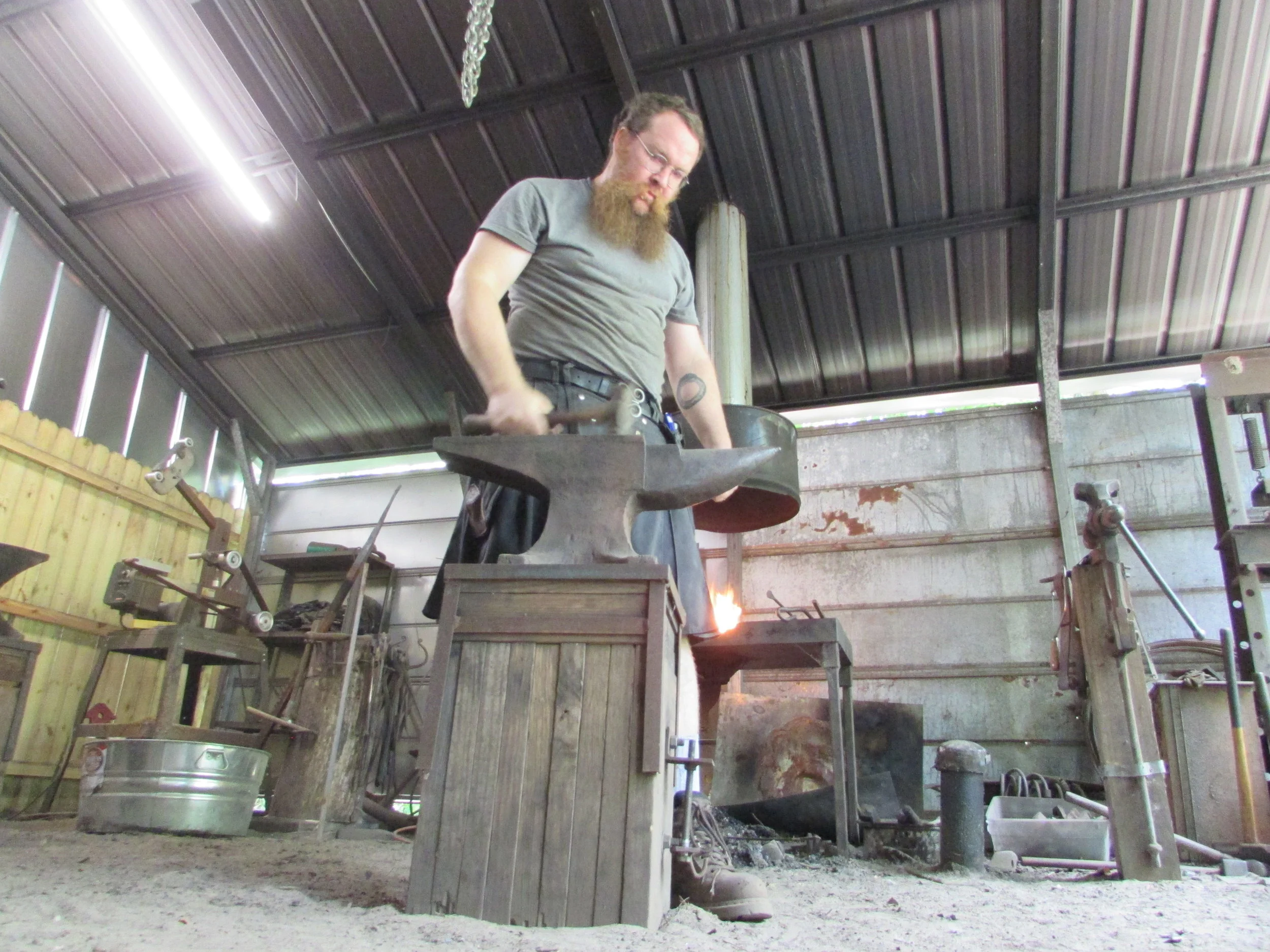 My and my dirt floor, and my anvil, and my hammer all working together!
