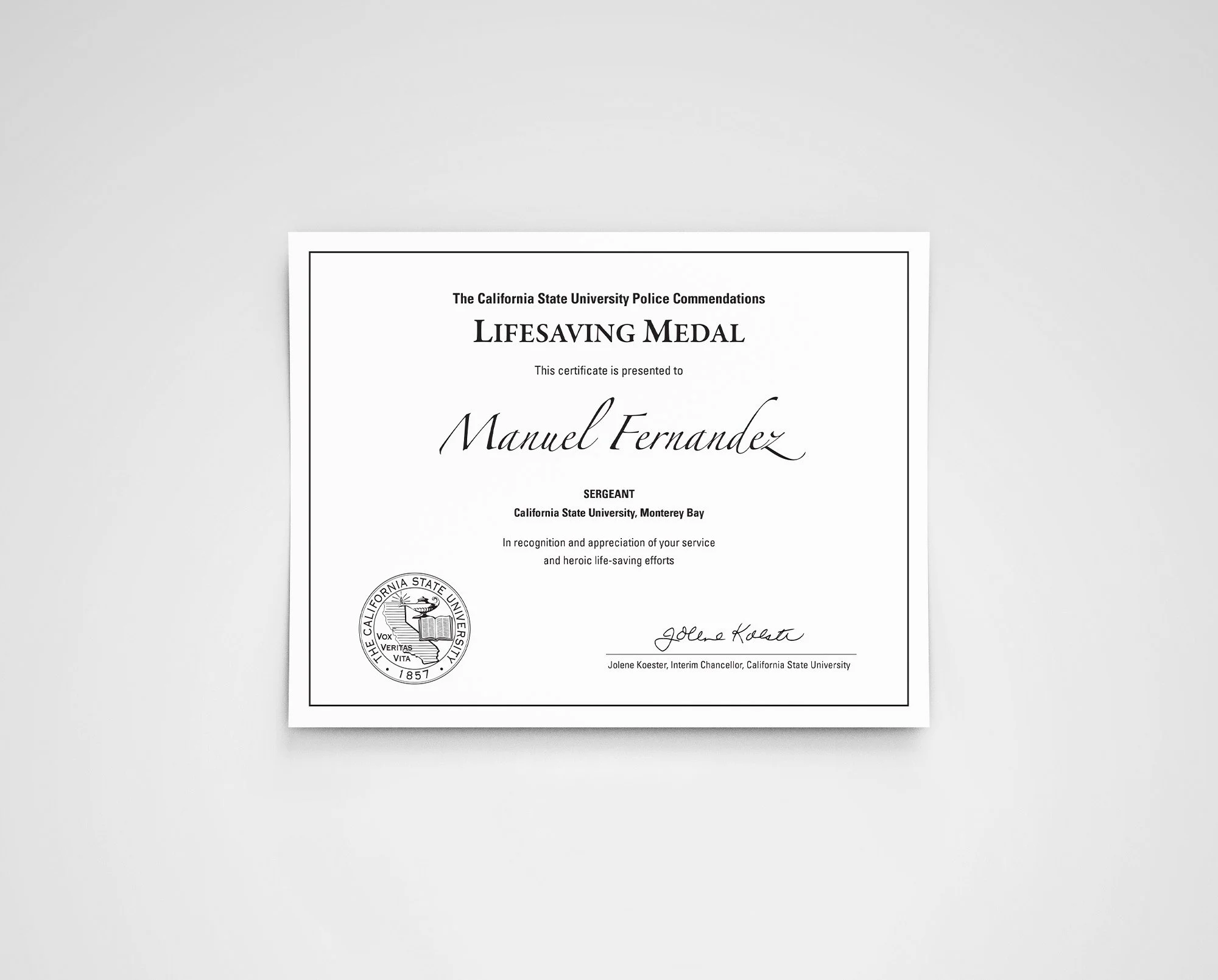 Certificate of Life Saving Medal awarded to Manuel Fernandez from California State University, Monterey Bay, signed by Jolene Koester.