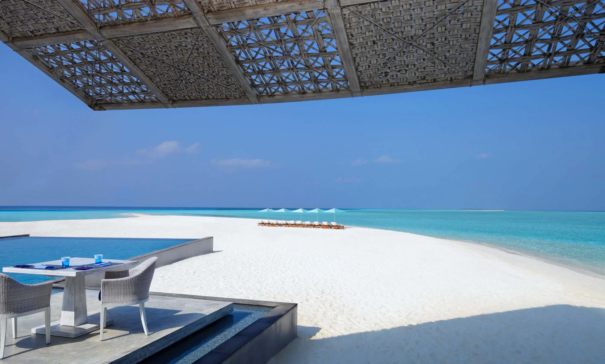 Four Seasons Landaa Blu Restaurant with view out to lagoon and sunlounges