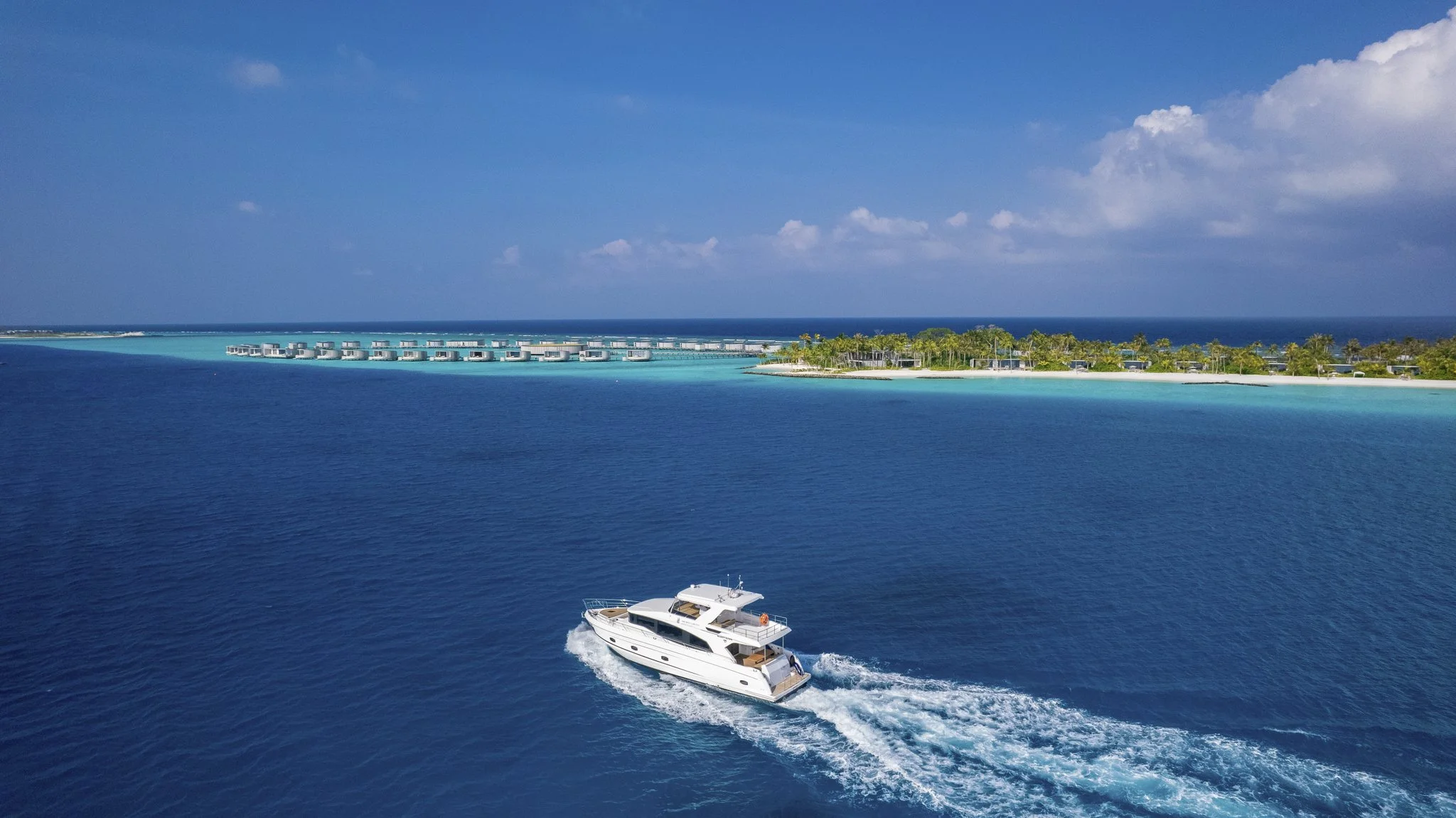Luxury yacht approaching maldives resort