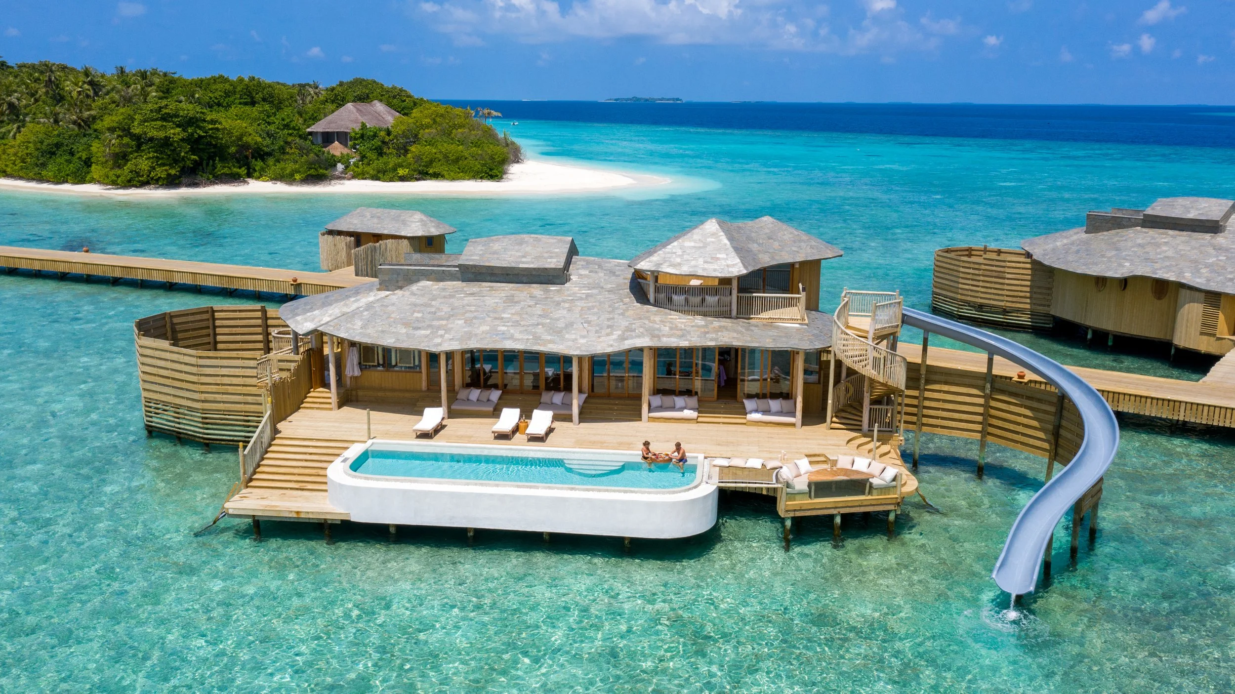 Over water villa with pool and water slide