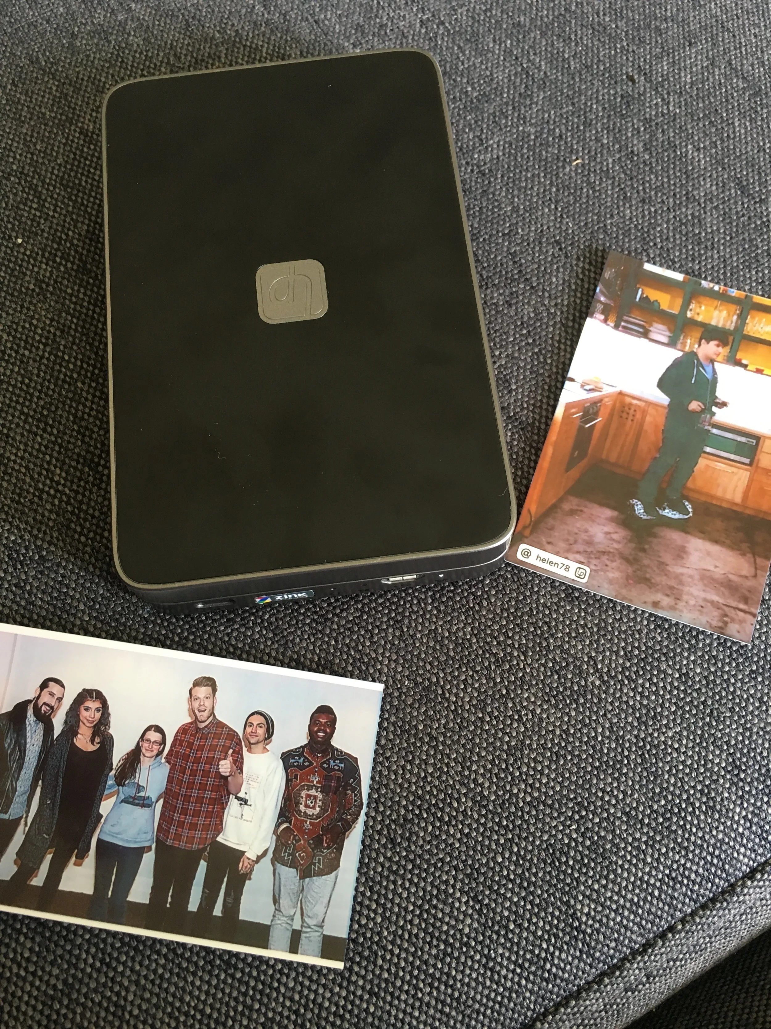 Lifeprint printer and a couple of examples. Left photo is from a video bottom is a regular photo print.