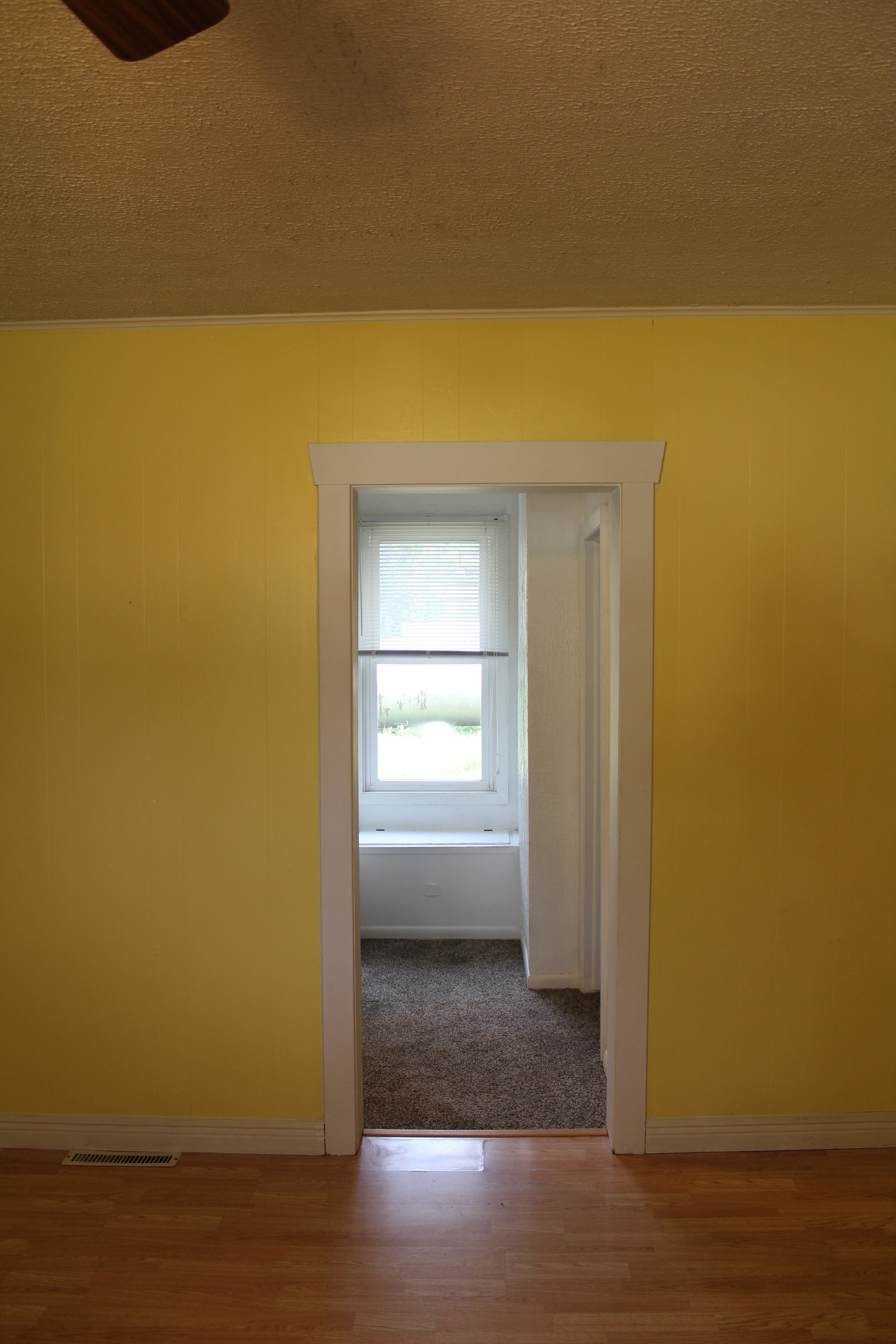 The hallway before....hello yellow walls!