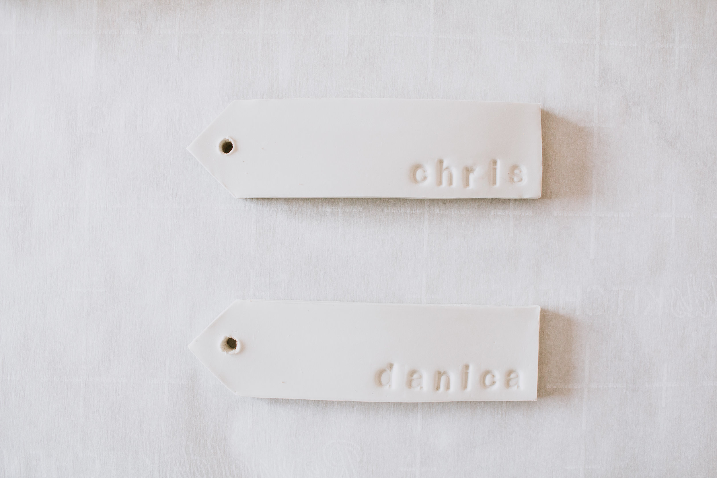 Creative gift wrapping with clay name tags. DIY personalized clay gift tags by Refined Design - clay name tags you can make from home! Perfect craft project and gift idea for weddings, Christmas, holidays, and birthdays. Custom clay Christmas orname…