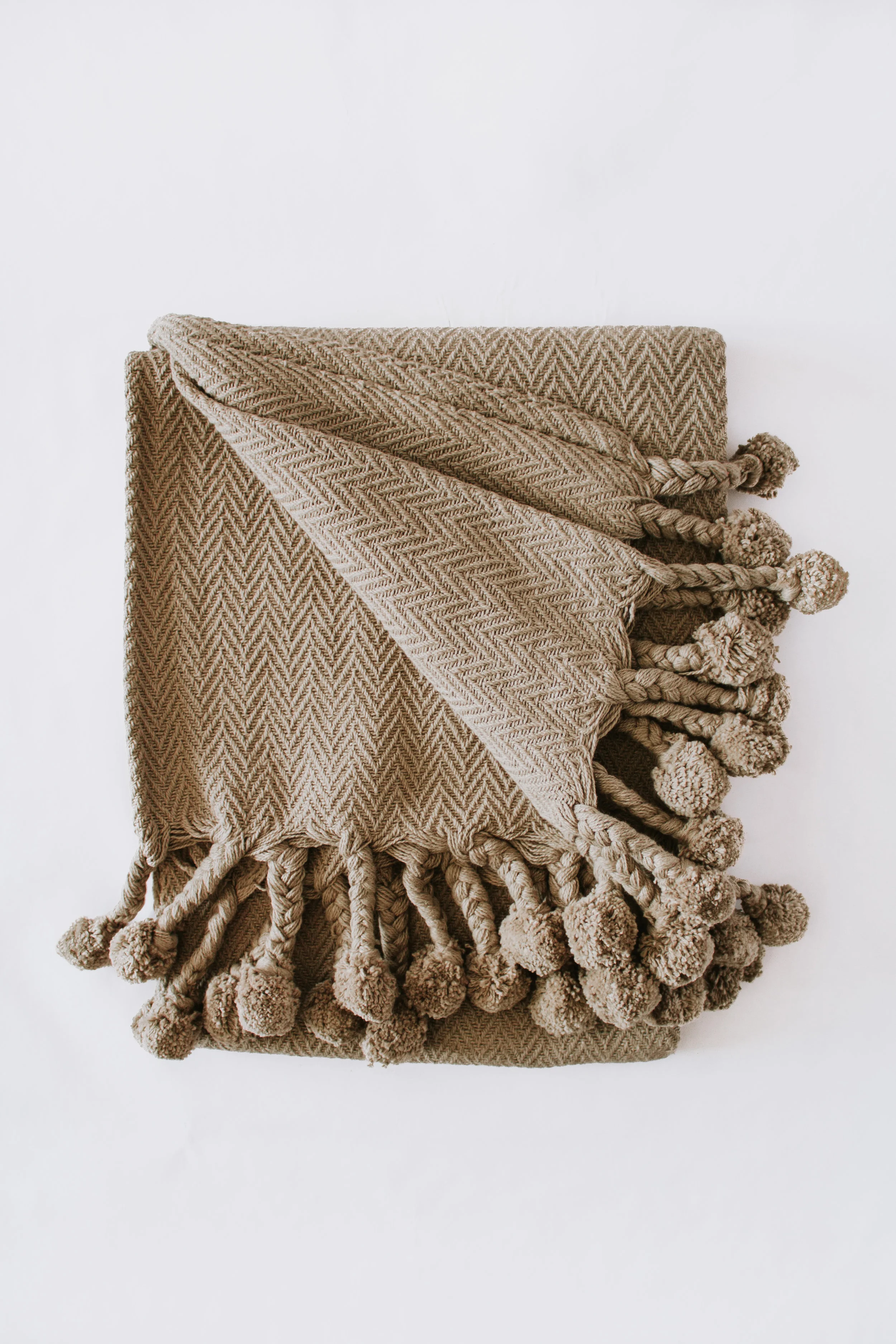 Rana Throw Blanket by Nadine Stay - Tan blanket with tassels and pom poms