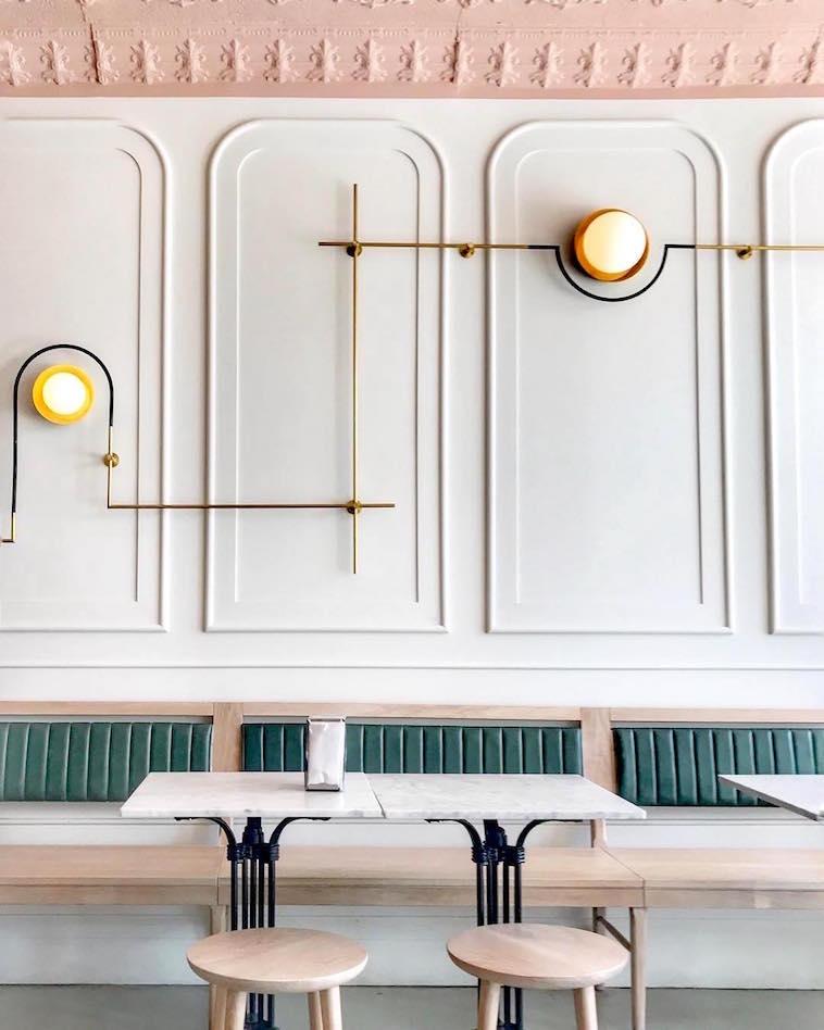My 10 Favorite Ways to Create Feature Walls - Interior Design Tips by Nadine Stay. Reverse picture frame wainscoting in a restaurant. Photo by Girls Just Know.