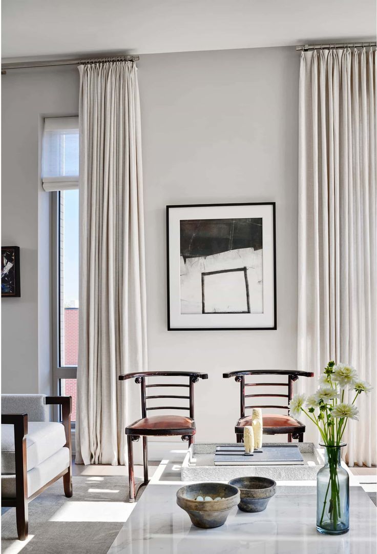 My 10 Favorite Ways to Create Feature Walls - Interior Design Tips by Nadine Stay. Use floor to ceiling curtains to create a dramatic focal point in the room. Design by Andrea Goldman